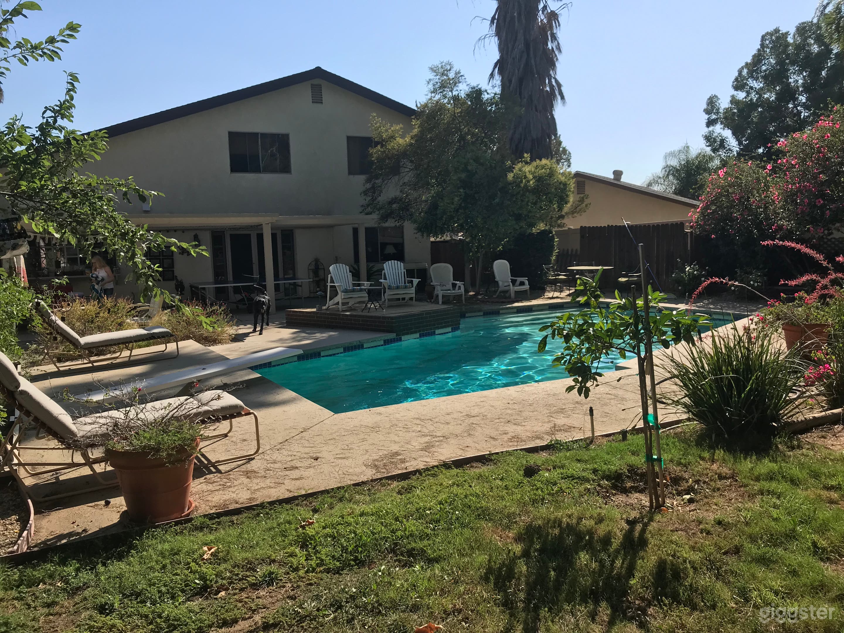 Warm home with large grass yard and pool Photo 2