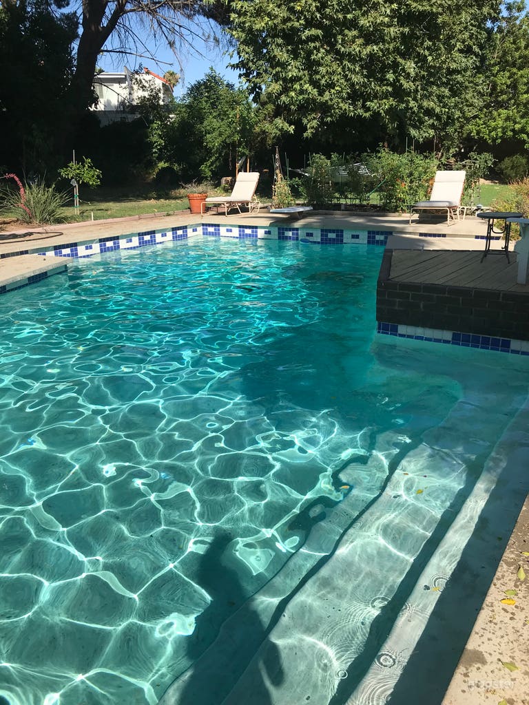  Warm home with large grass yard and pool 