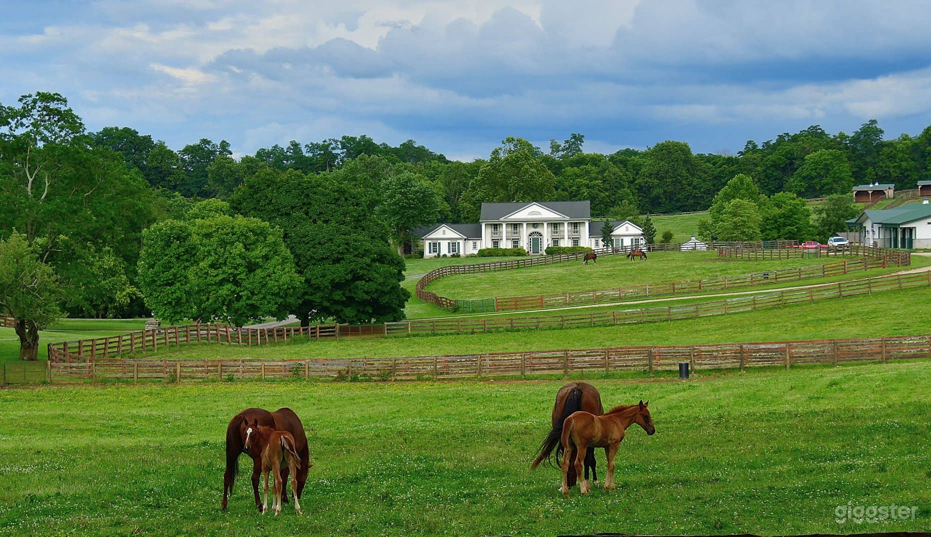 Queenslake main residence: a 6,000 sqft home with 6BR, 5BA, and covered porches on all four sides with a 2car garage, gameroom, dining room, and gigantic Kentucky kitchen.