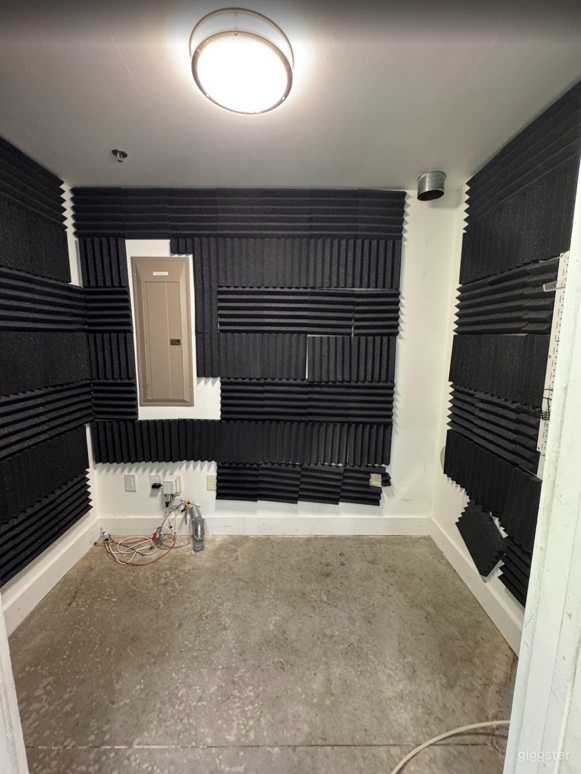 Sleek All-White Creative Space with Concrete Floors Photo 4