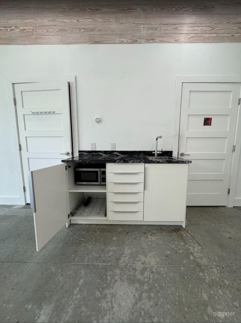  Sleek All-White Creative Space with Concrete Floors 