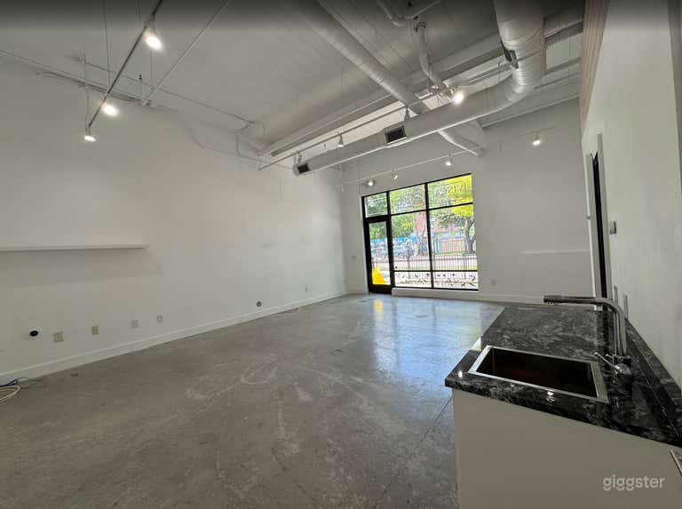  Sleek All-White Creative Space with Concrete Floors 