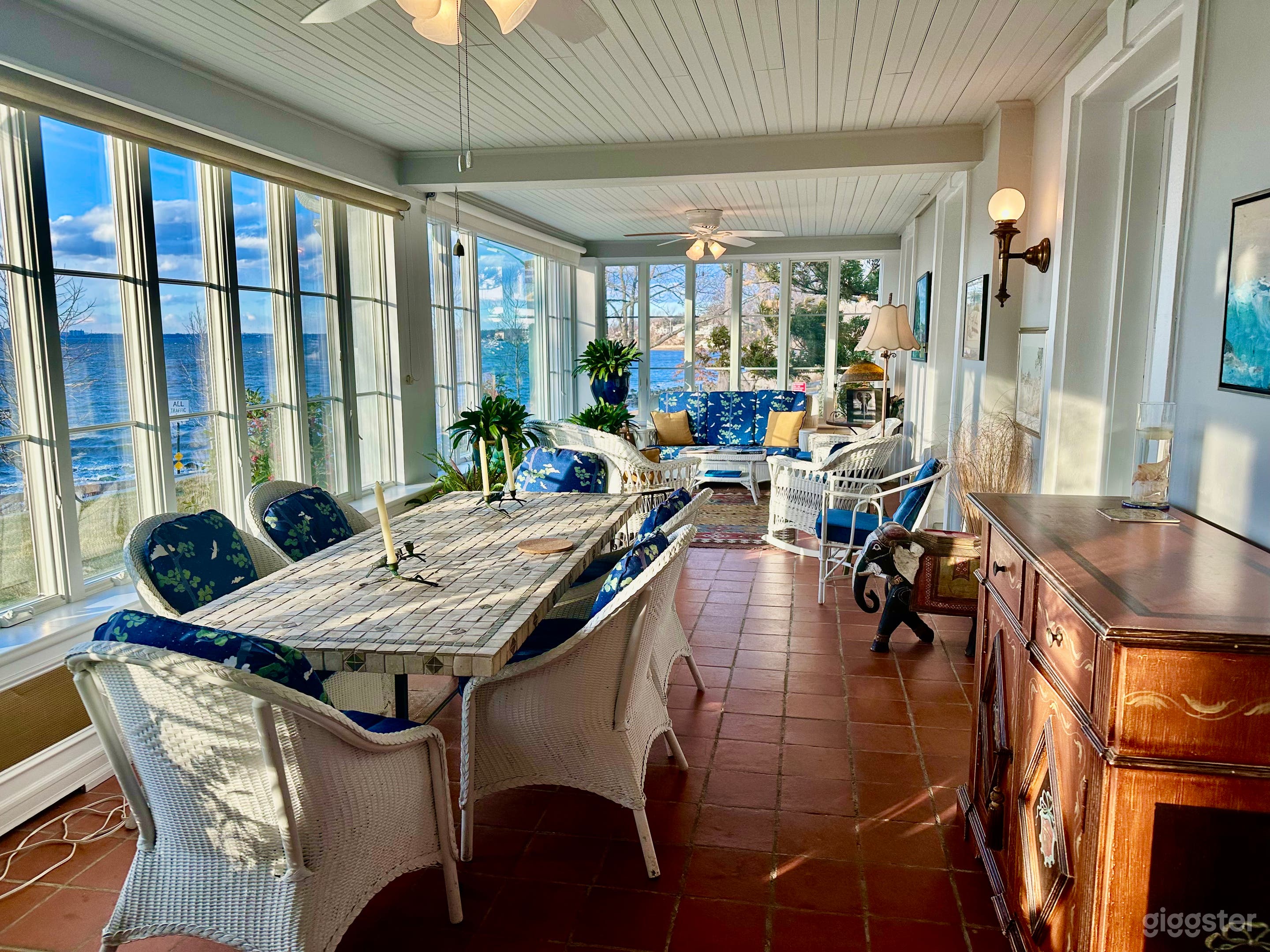 Porch has stone table and sitting area