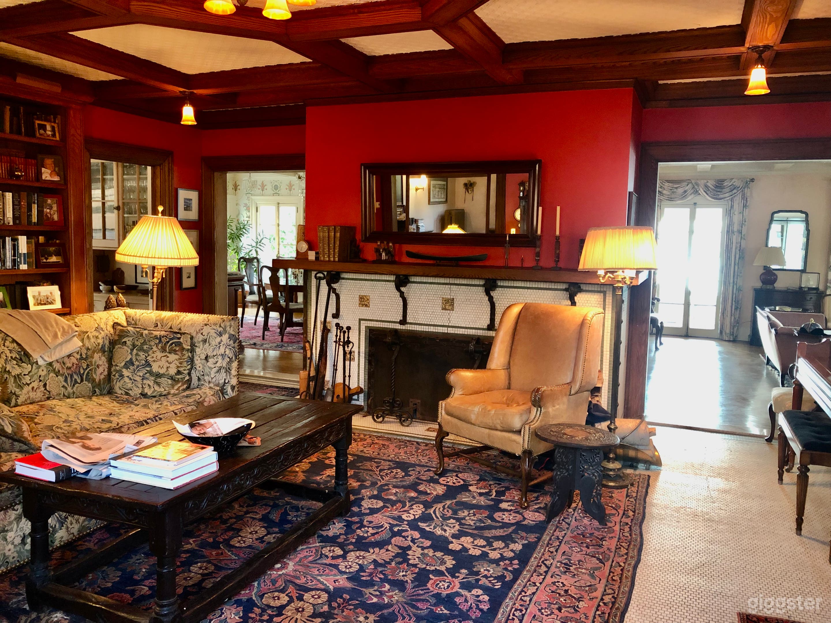 Entrance room/sitting room with Moravian fireplace; LR on R, DR on L, French doors to porch in background, K in L corner 