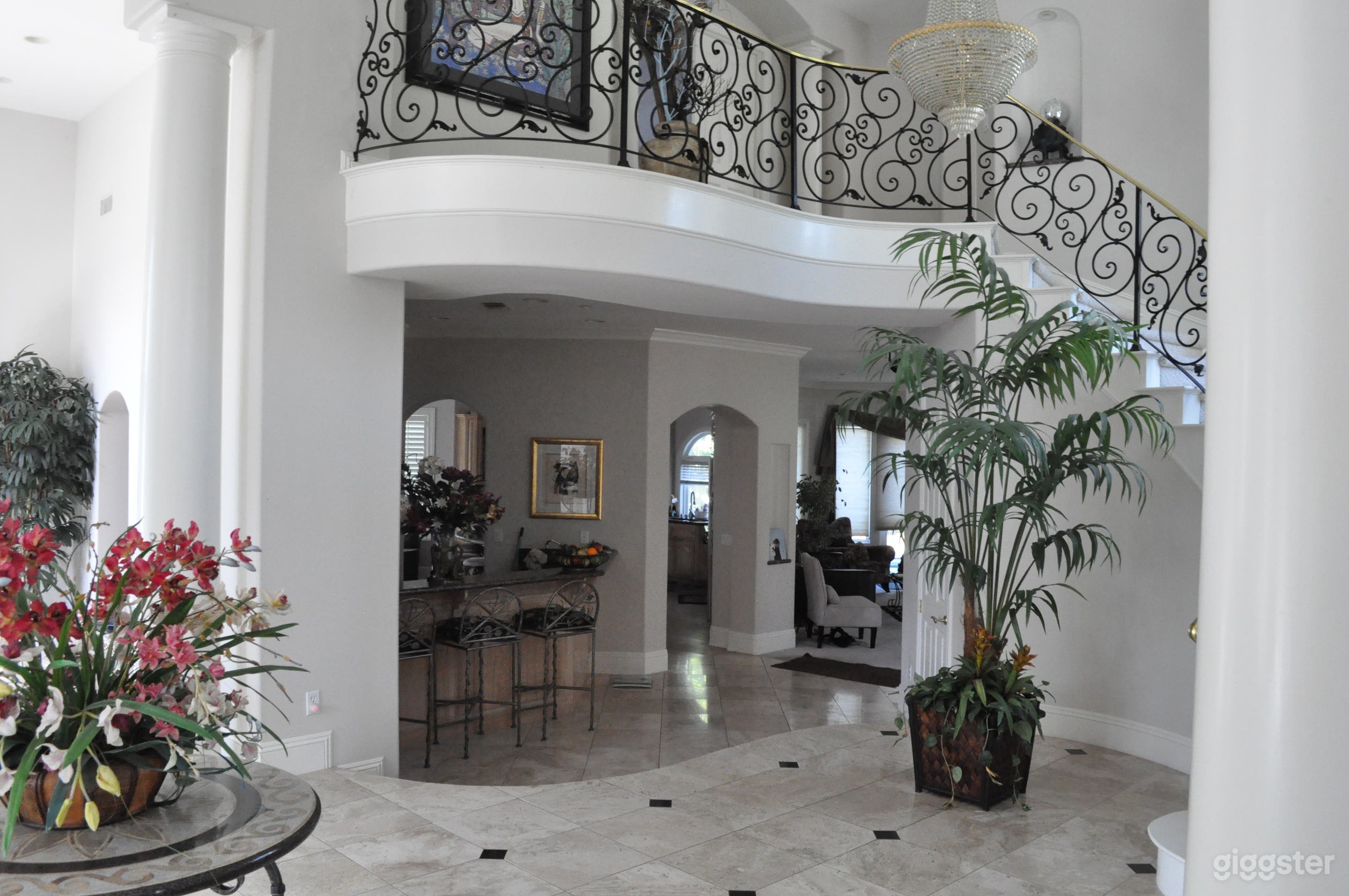 View from the foyer looking up the stairs to the second floor .Plenty of large windows for lighting