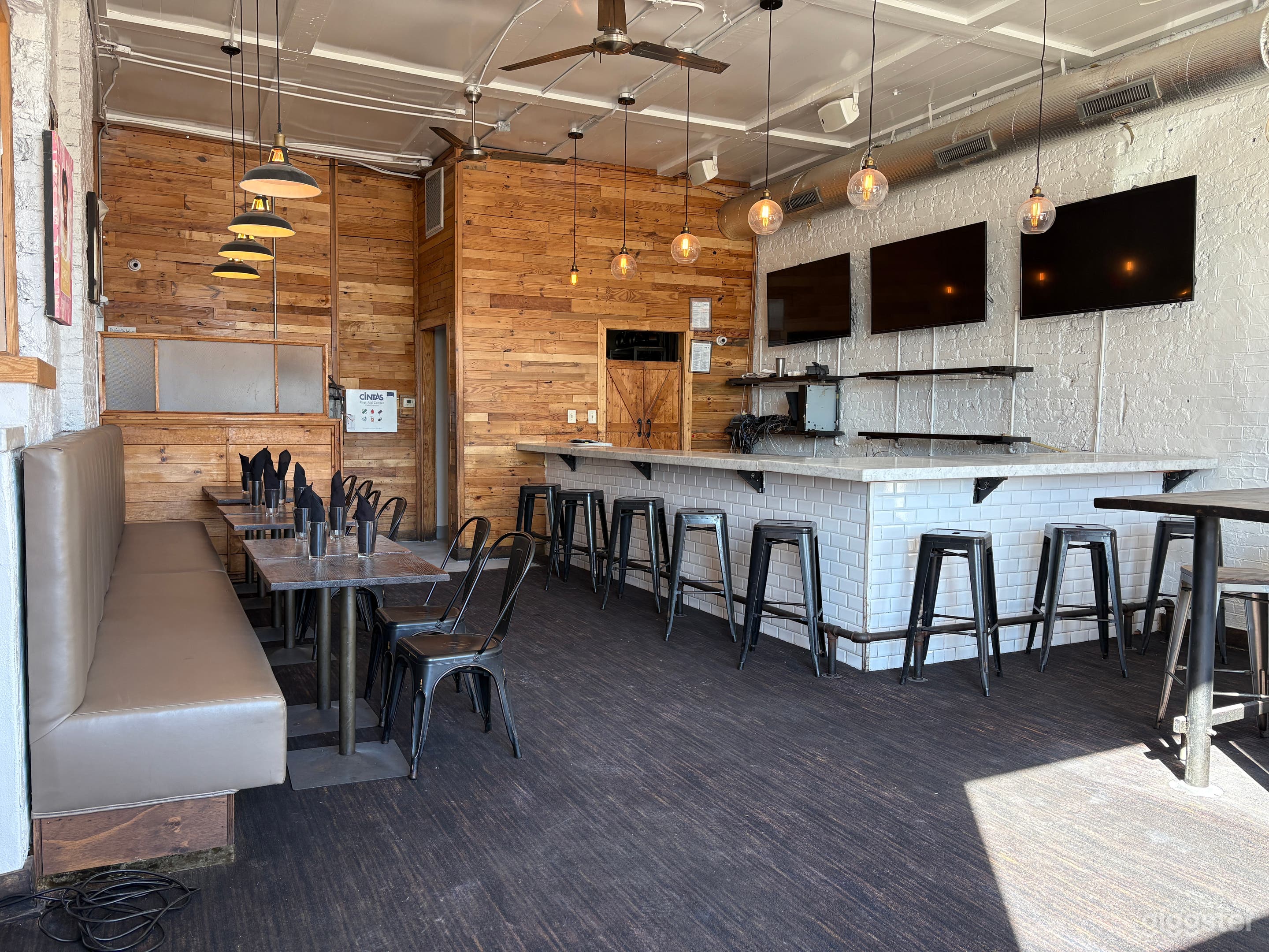 Modern Restaurant & Bar with Murals, Natural Light Photo 1