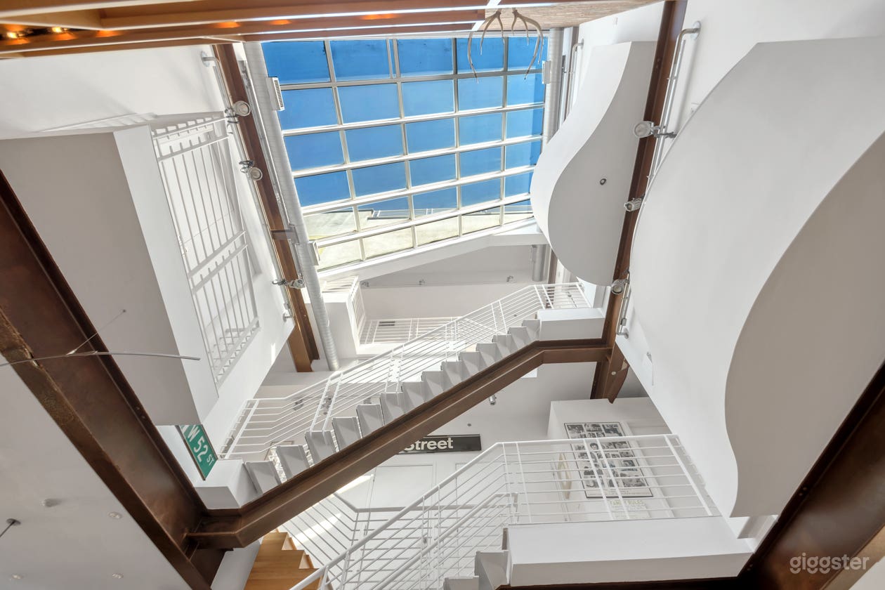 Looking up from the living room at the large glass atrium ceiling. 
