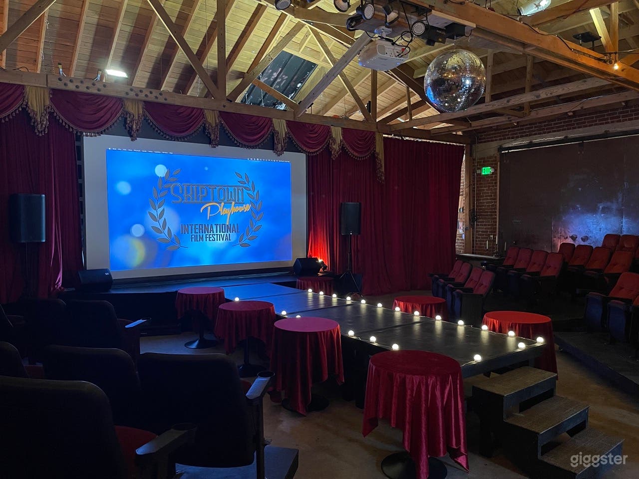 Gorgeous theater venue with red velvet curtains Photo 2
