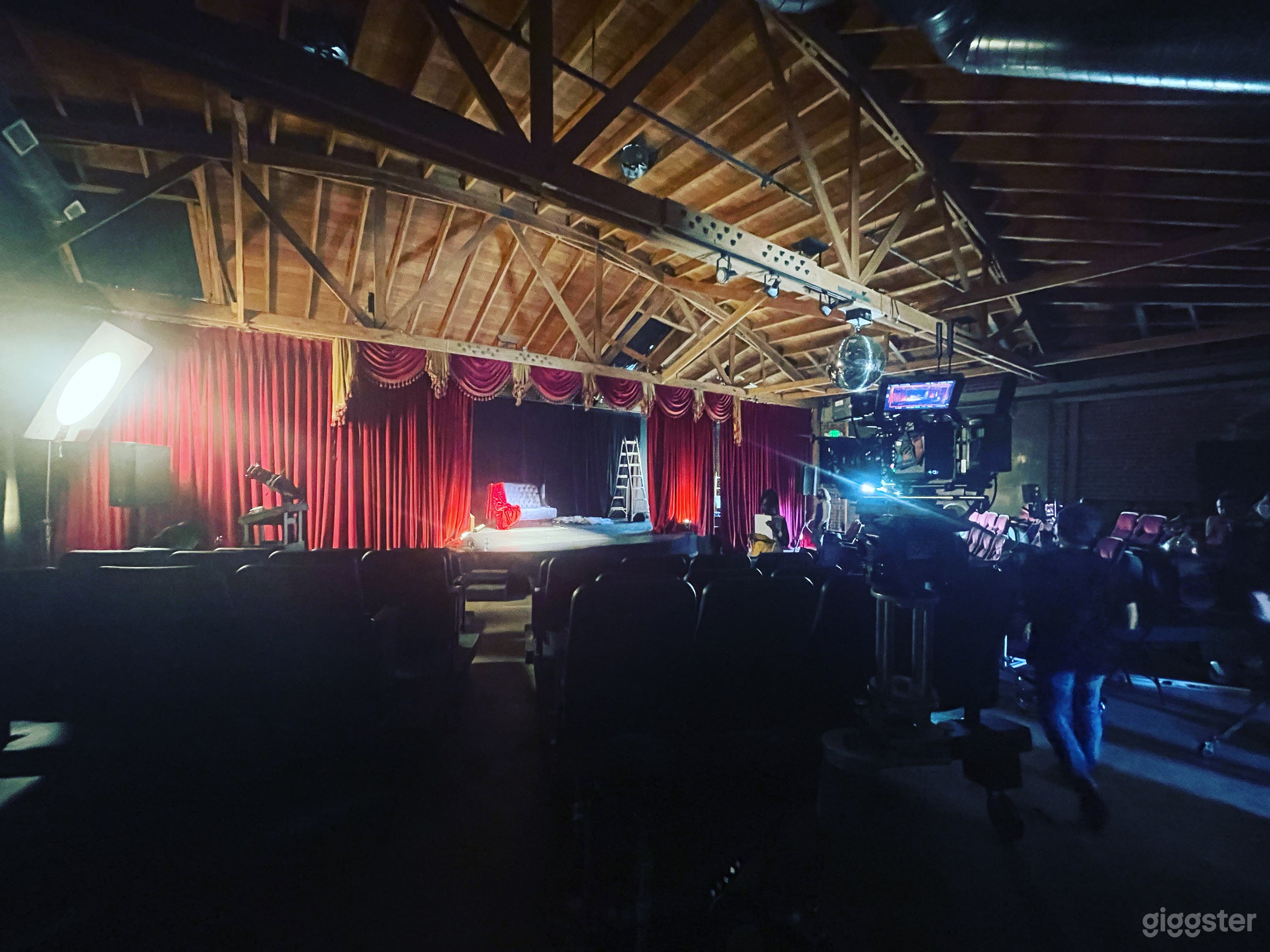 Gorgeous theater venue with red velvet curtains Photo 1