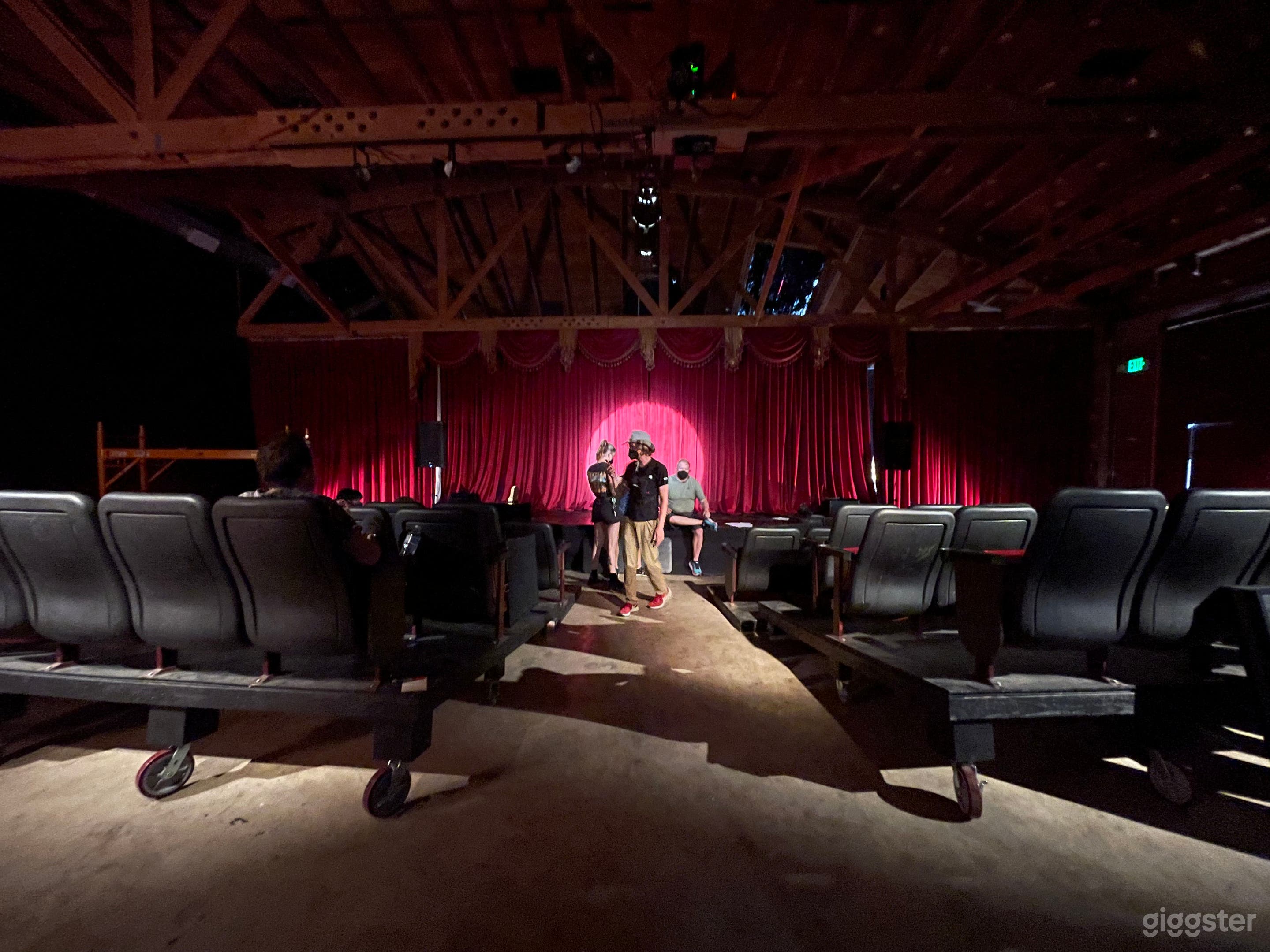 Gorgeous theater venue with red velvet curtains Photo 4