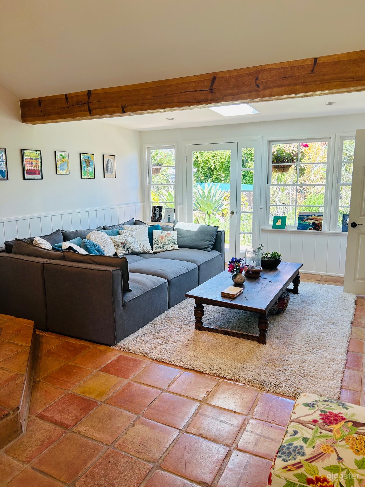 Open plan den with oversized pit couch