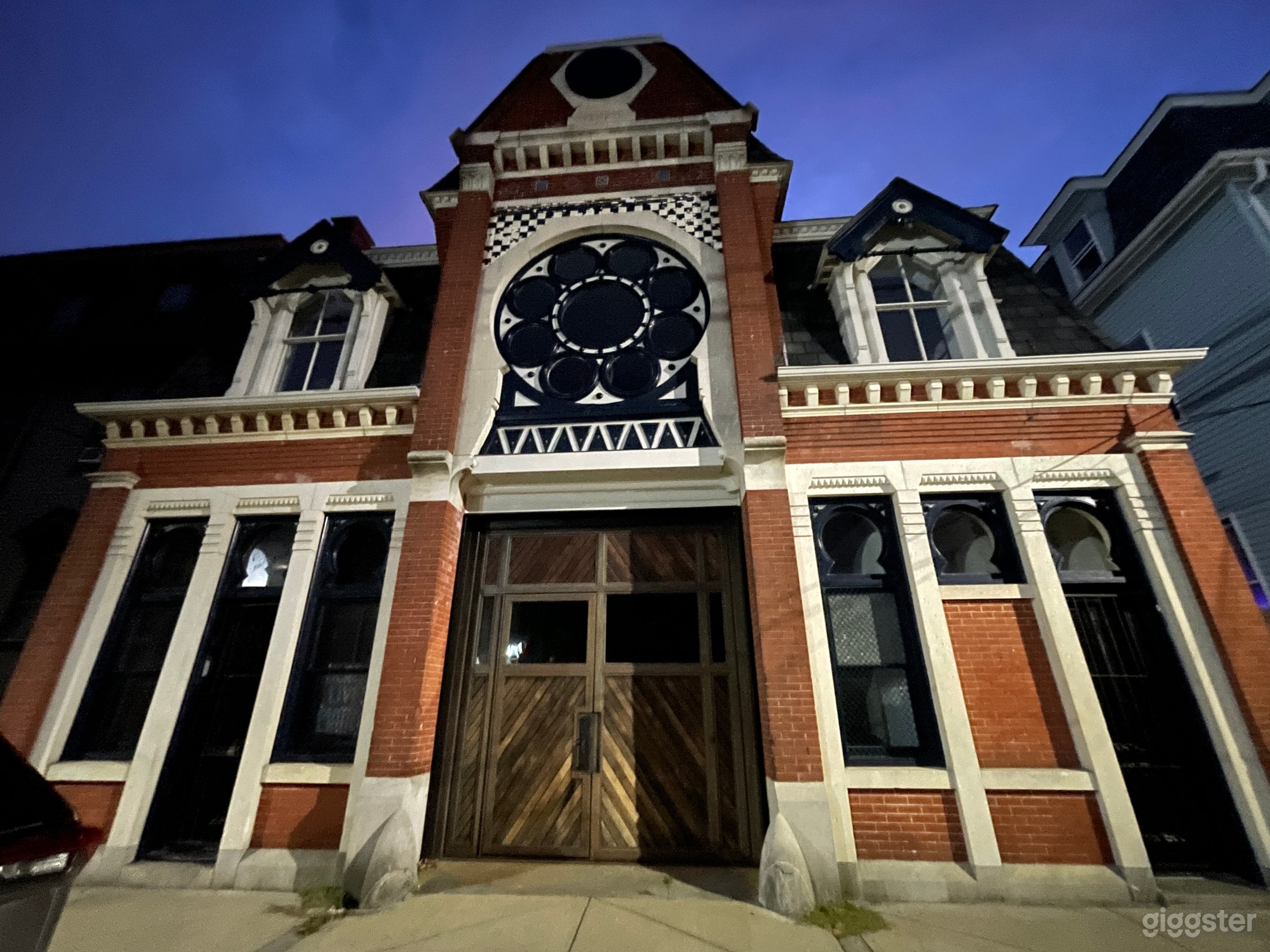 Exterior with center entrance and Tack Room entrance on left. Door opens and whole wooden door can swing in to open.