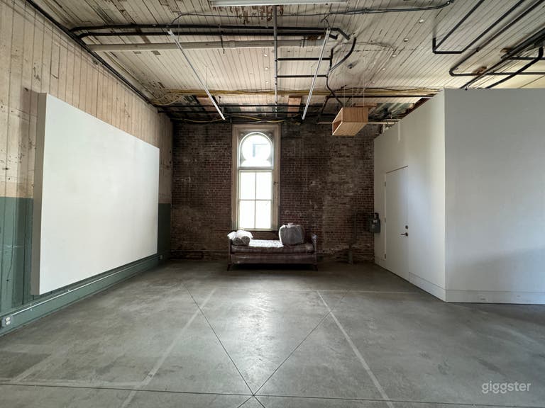  One side of Pop-Up space and arched window 