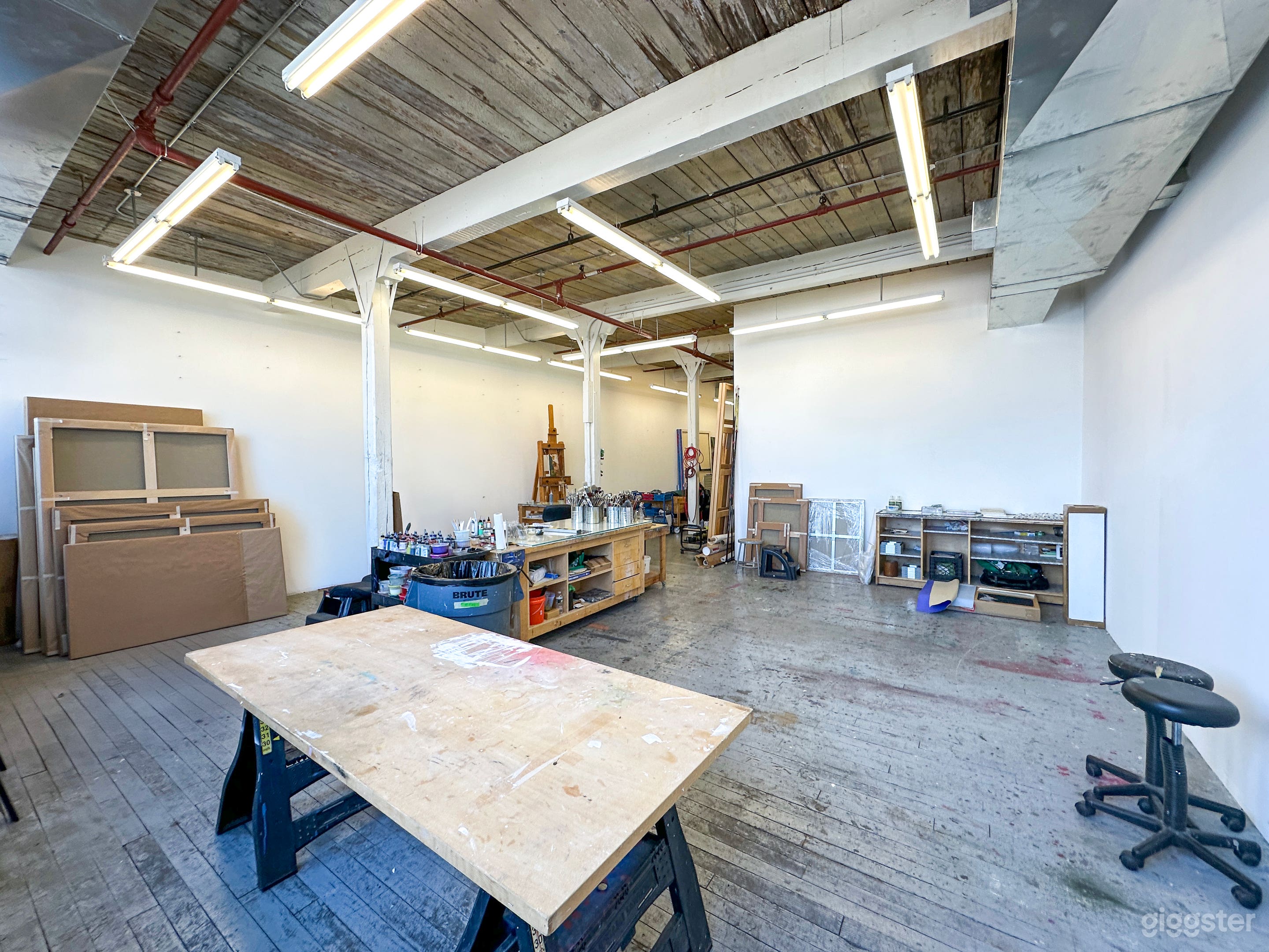 Bohemian artist studio in Gowanus. paint on floor Photo 3