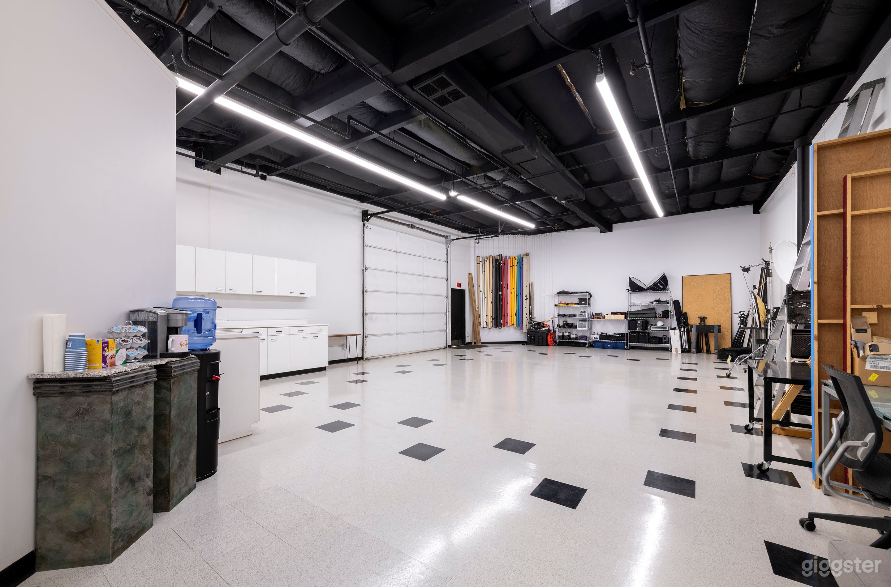 Main shooting area with 14 ft. ceilings and 12 x 12 ft. garage door.