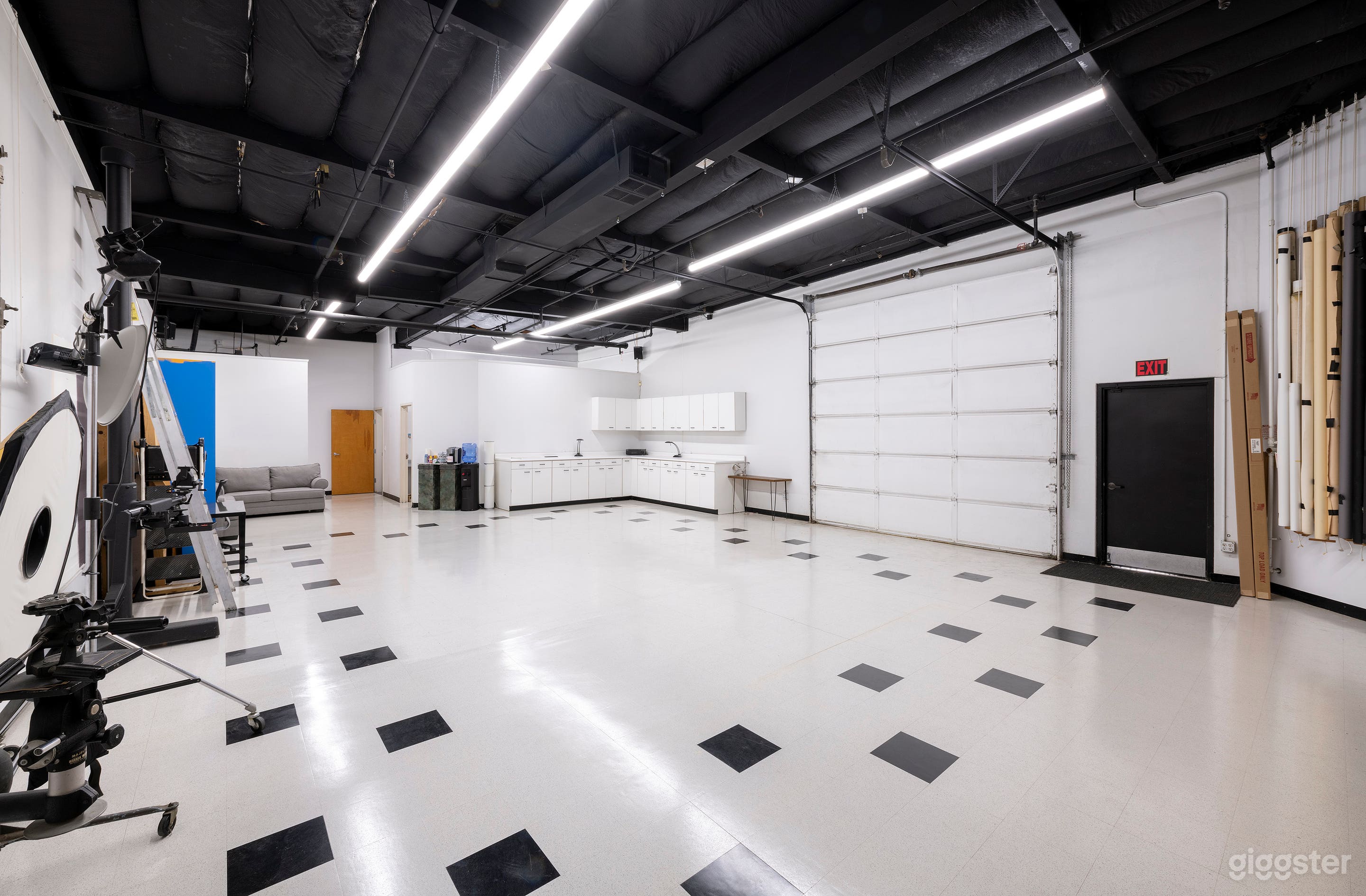 Main shooting area with 14 ft. ceilings and 12 x 12 ft. garage door. Back view