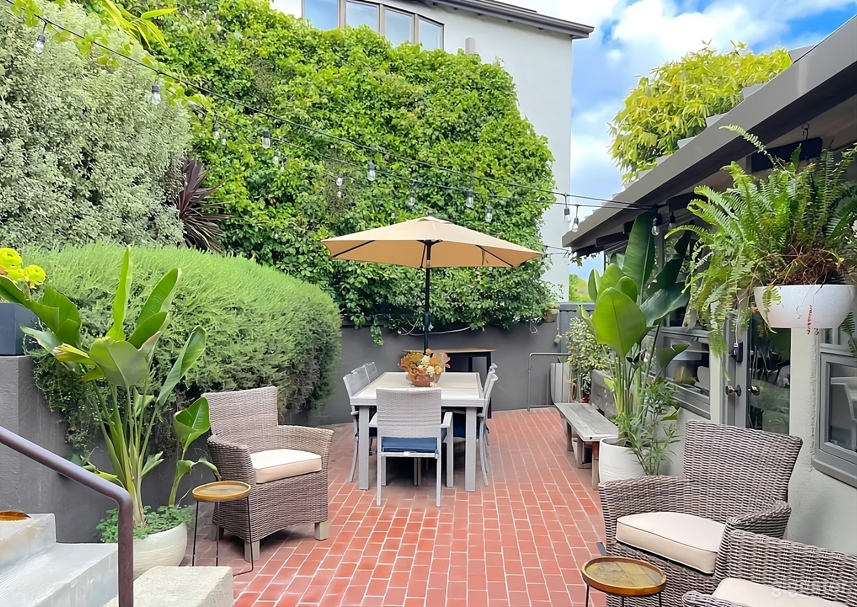 Secluded Tropical Modern Backyard Photo 1