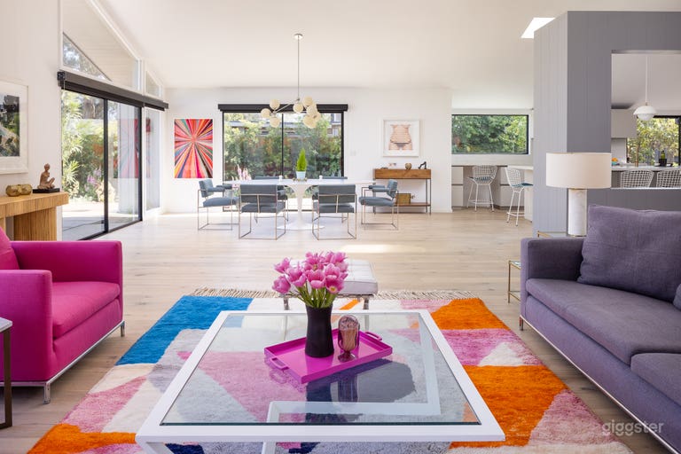  Living, Dining and Kitchen are all in the main room with dramatically high celings and surrounded by glass.  Open all sliders for true indoor/outdoor living. 