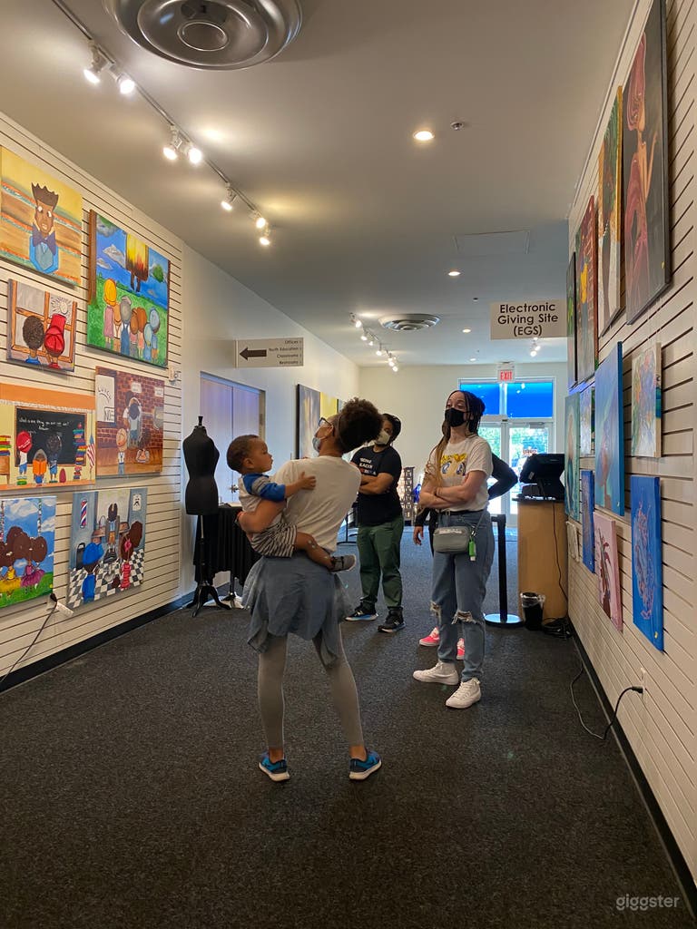  Far wall facing door, exhibit visitors 