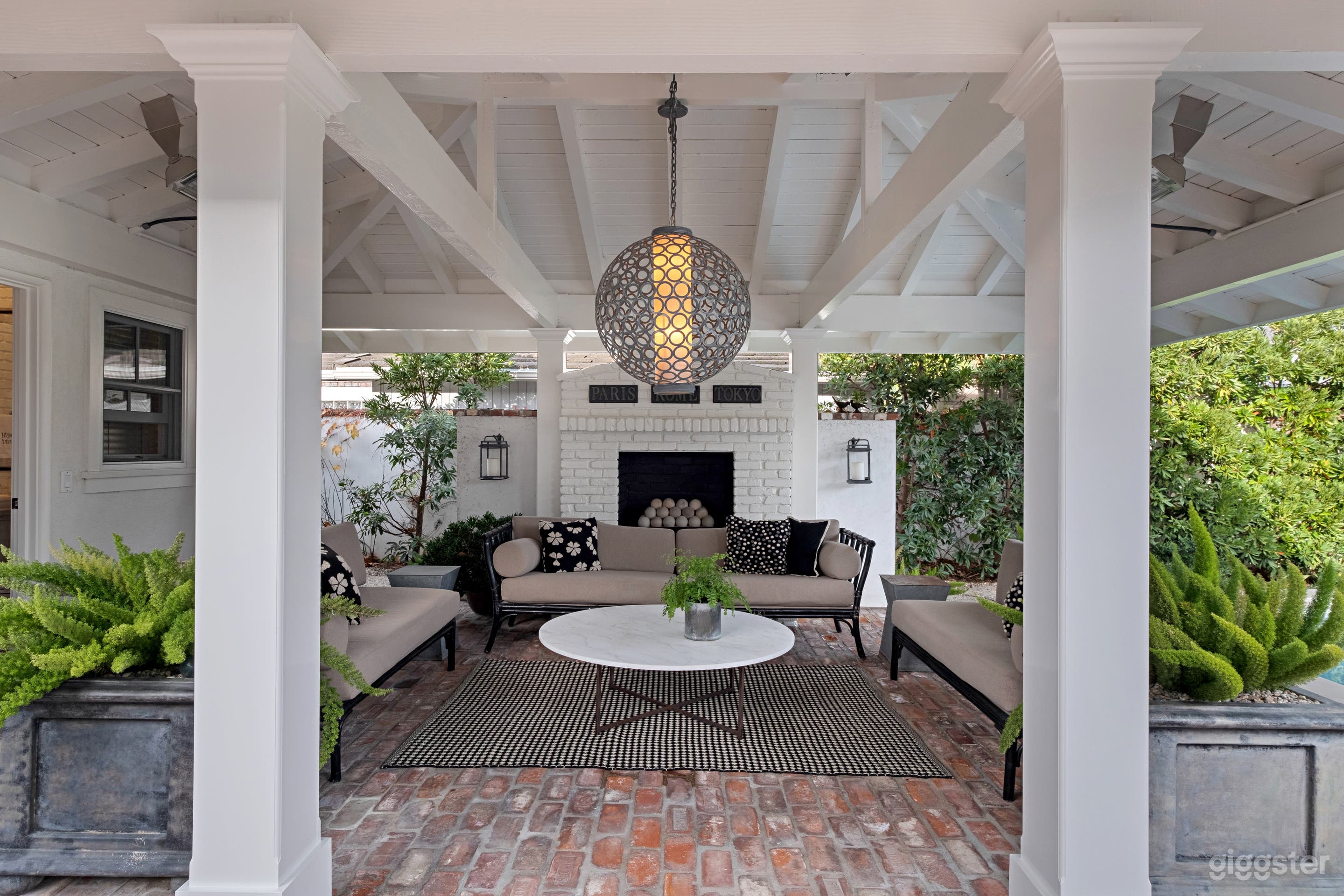 Outdoor room in backyard functions as an additional family room.  Includes pool bath, steam room and custom lighting