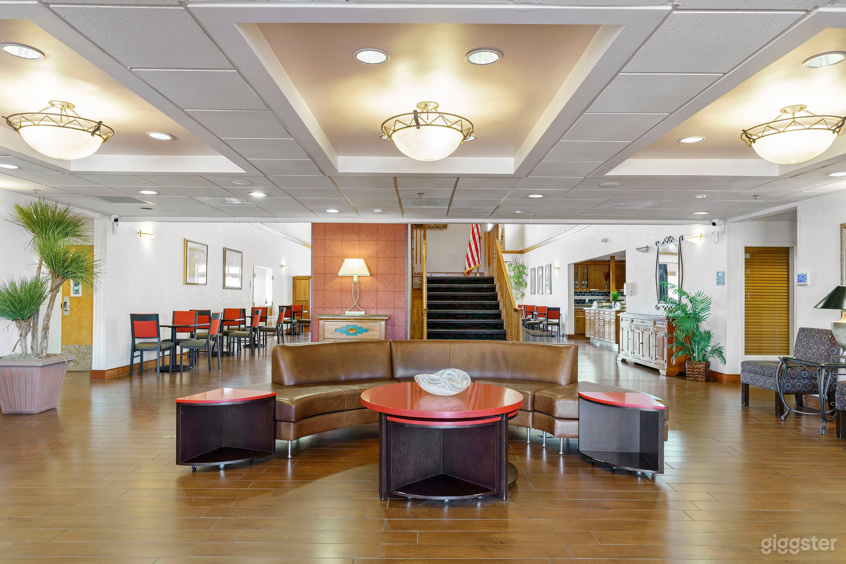 Lounge amenities including kitchen, TV, gym