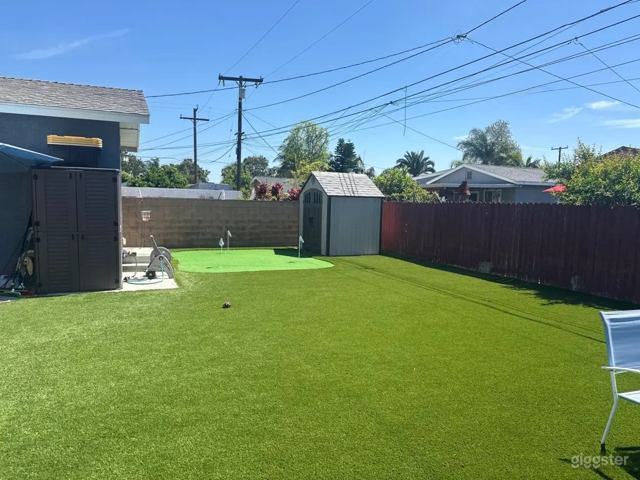 Spacious Backyard with Turf Field Photo 1