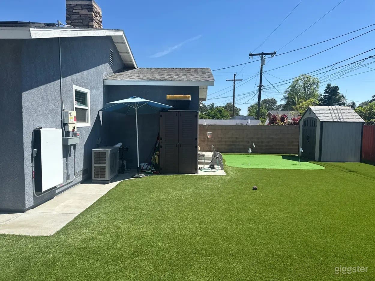 Spacious Backyard with Turf Field Photo 2