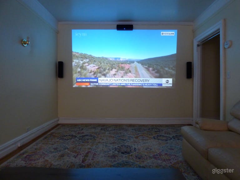  Living Room has surround sound home theater with HD projector. 