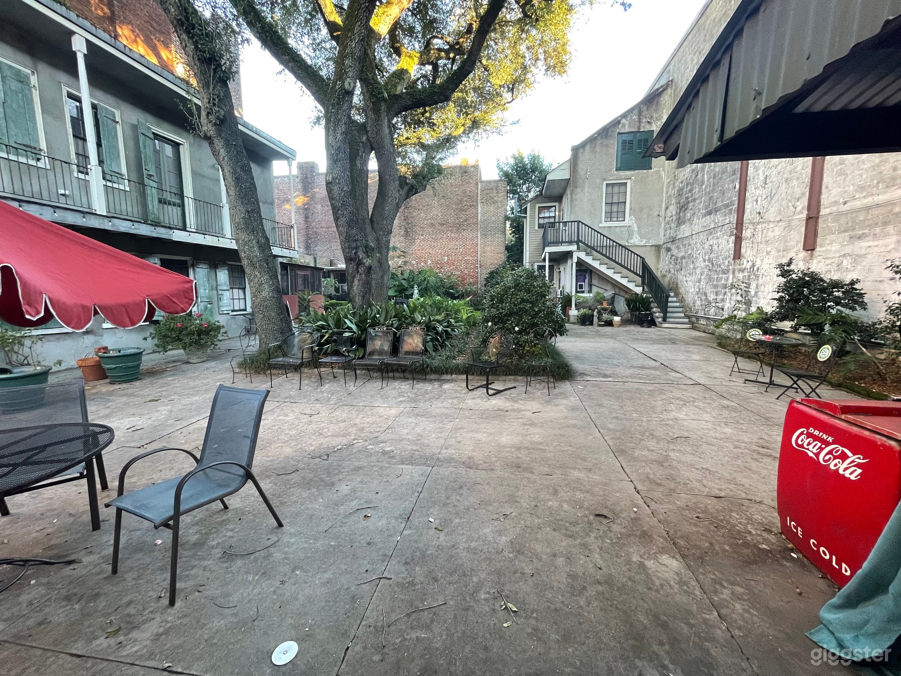  Coutyard and out building backdrop. this is your chabby chic view w one back brick wall, chicken coop backdrop, oak  trees, textured cement wall to left +++  Fill up that coke machine to the brim, add a buffet or workshop table or 2 and Voila!