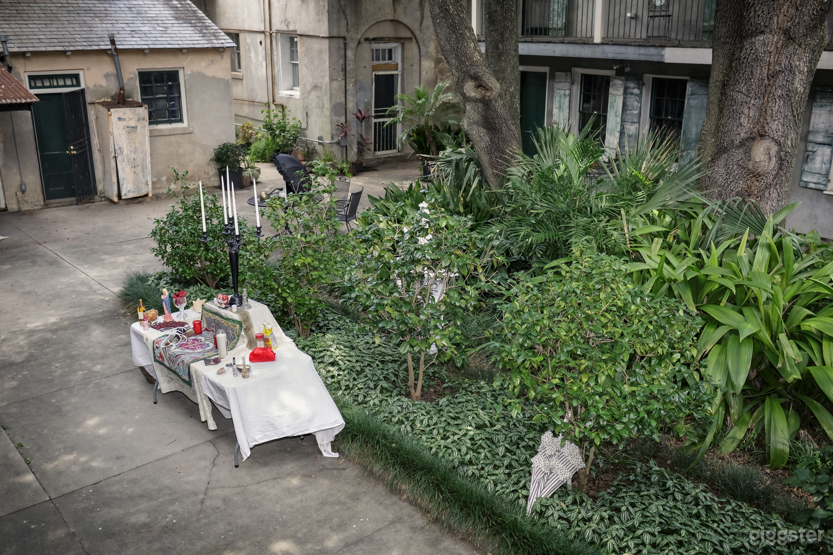 A scenic overview for your French quarter carriage house apartment down toward a ritual  altar for a wedding soon to start, Is is yours?   Haunted party,  funky luncheon, engagement, abundance ceremony or birthday bash - bachelorettes?