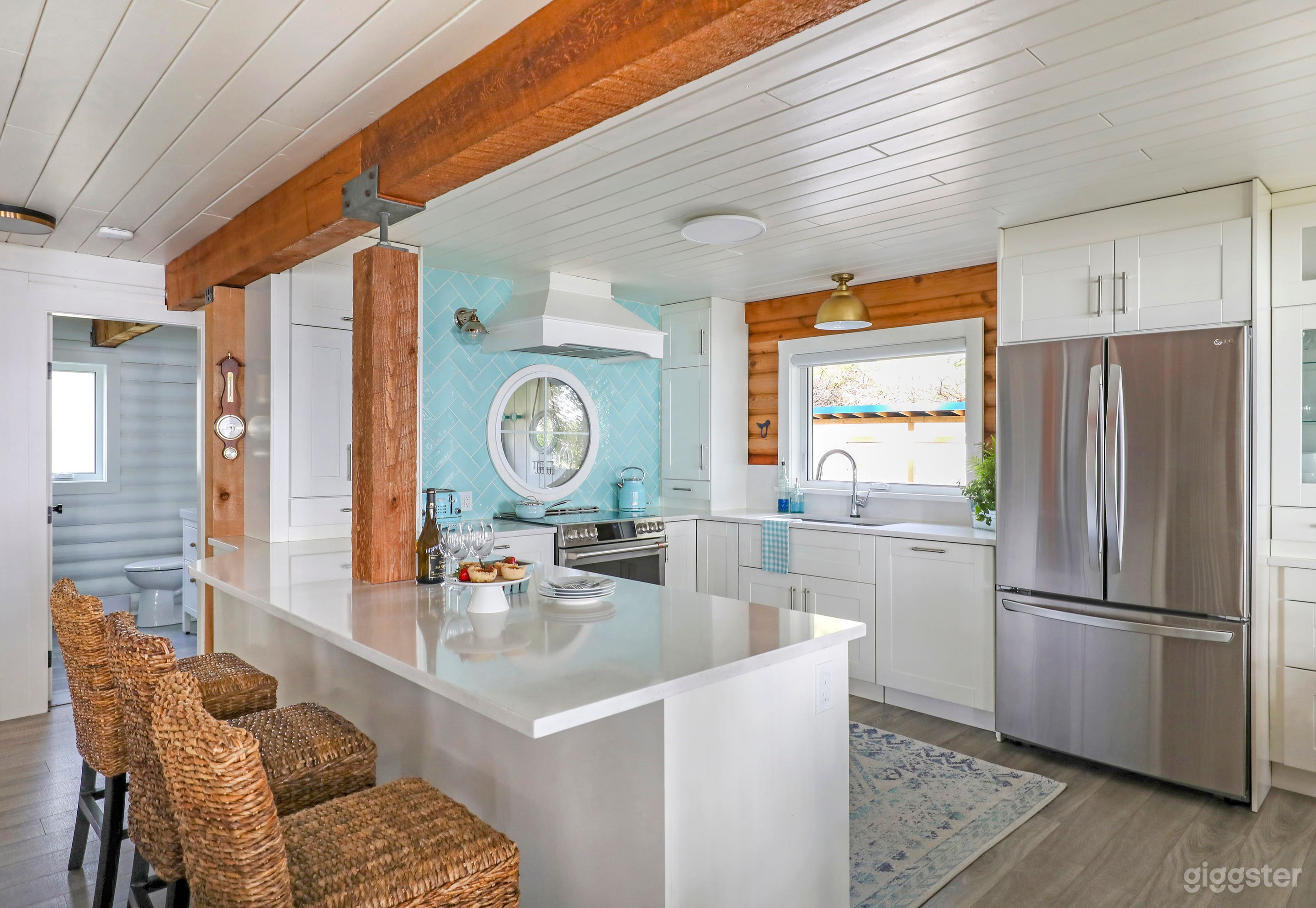 Light flows through the round window from the west facing mudroom.