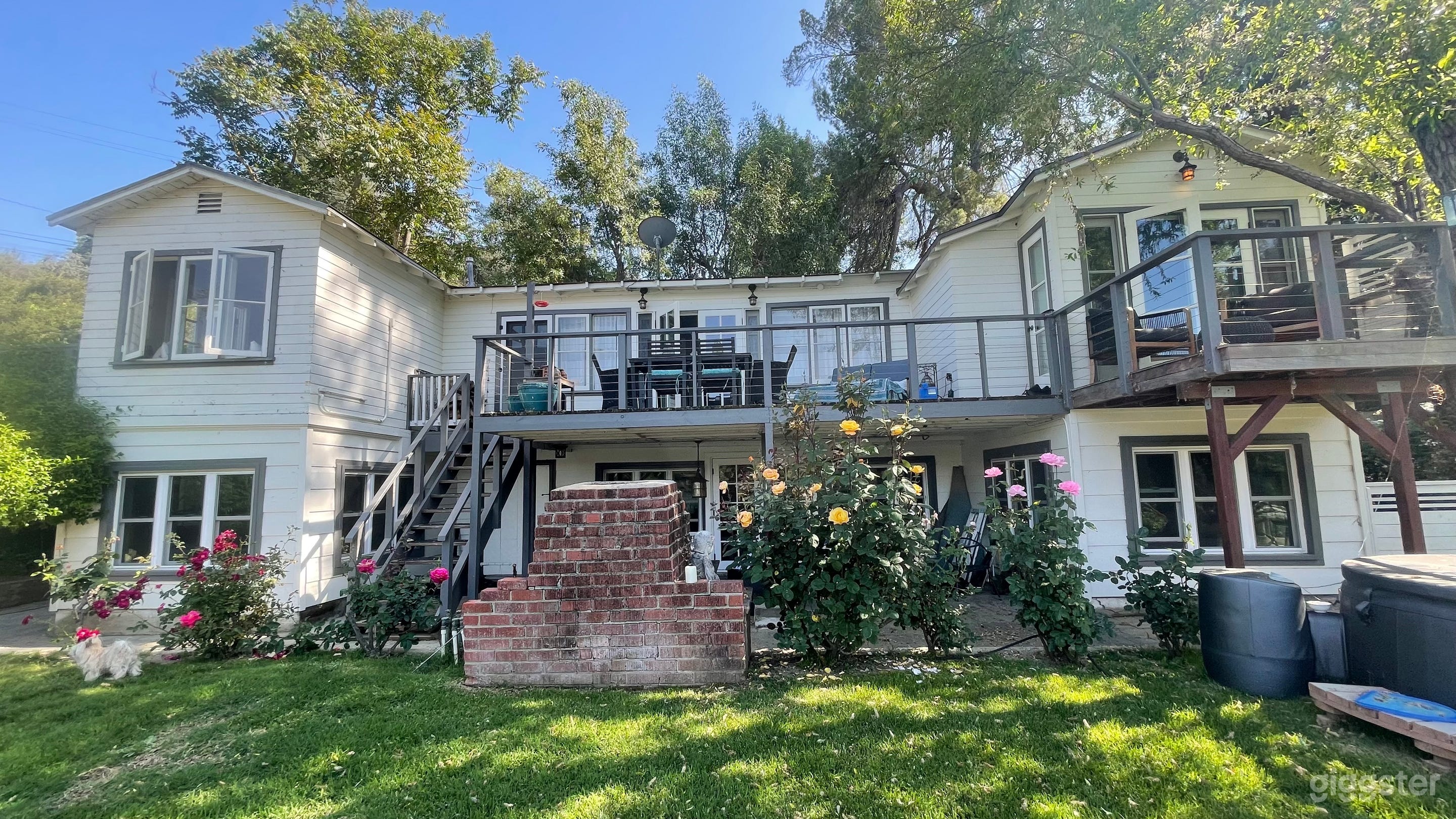 House facing lake with functional original built in bbq