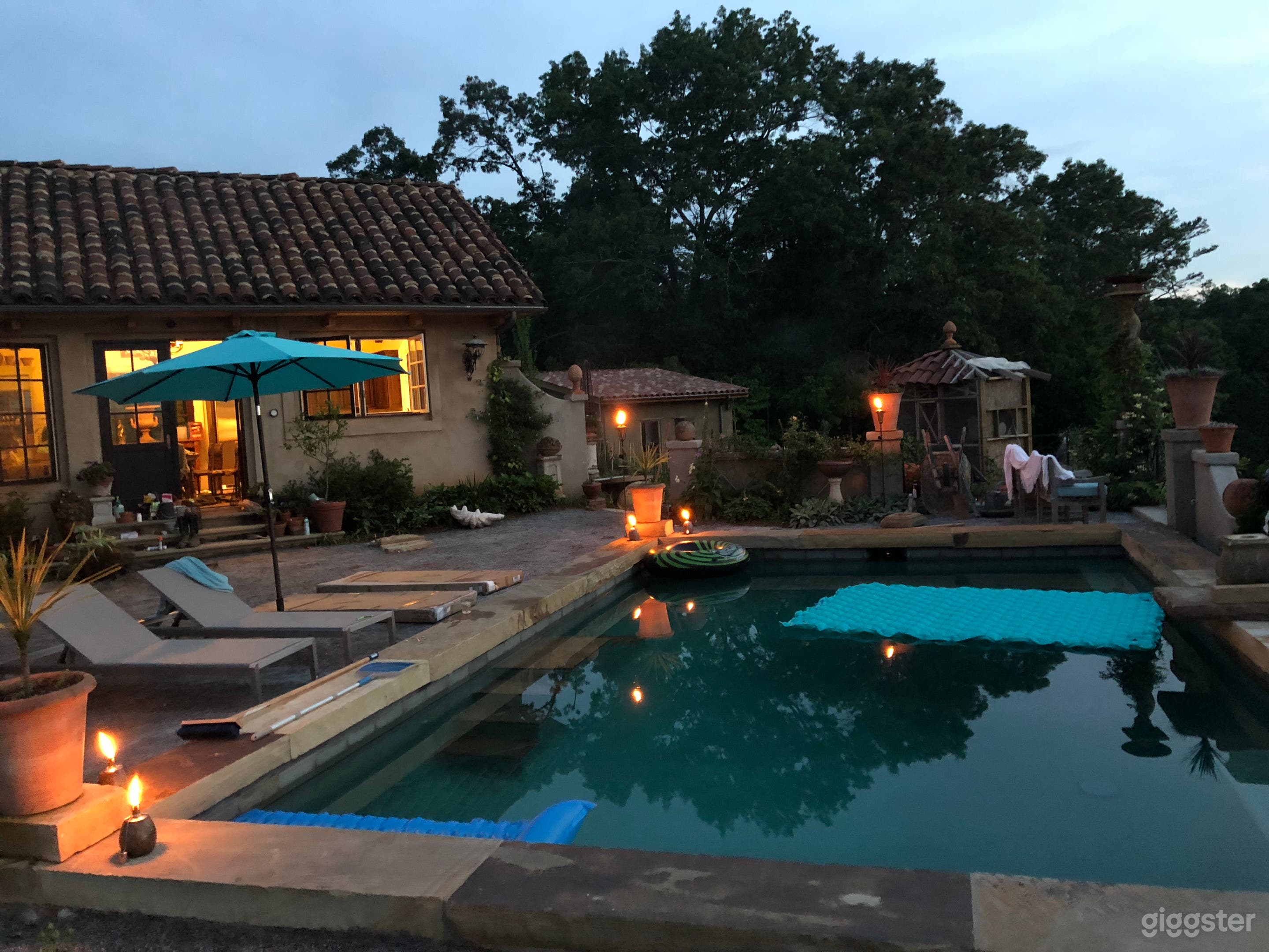 Pool terrace looking toward formal garden, greenhouse and aviary.