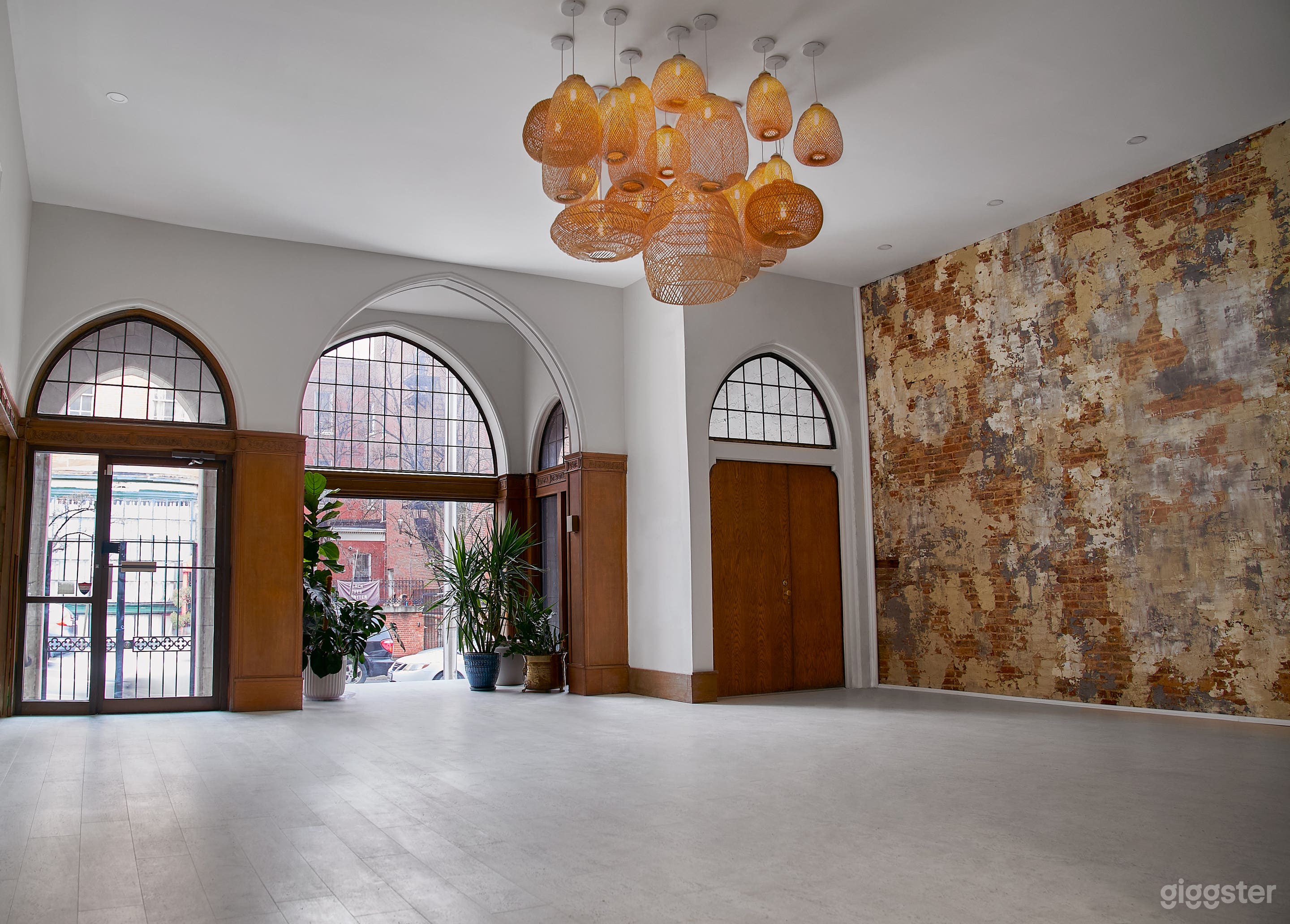 Arched windows offer a dramatic backdrop to your light-filled photo shoot.