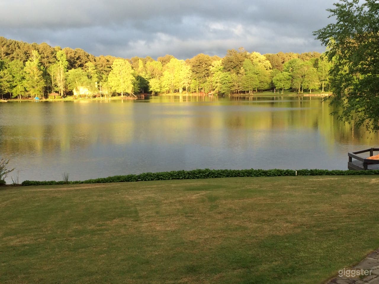 Sun on Trees across lake at sunset
