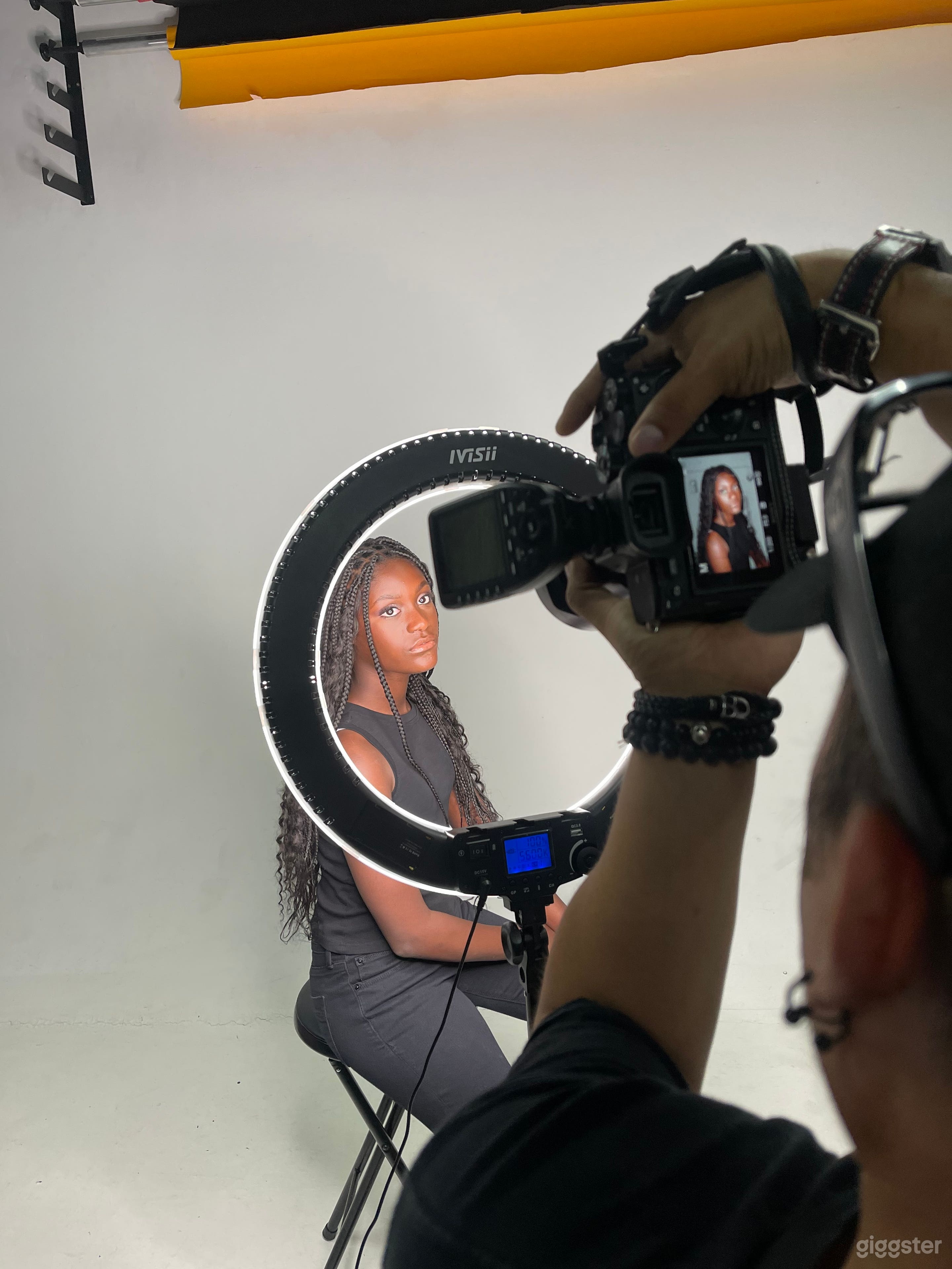 White cyclorama wall with ring light