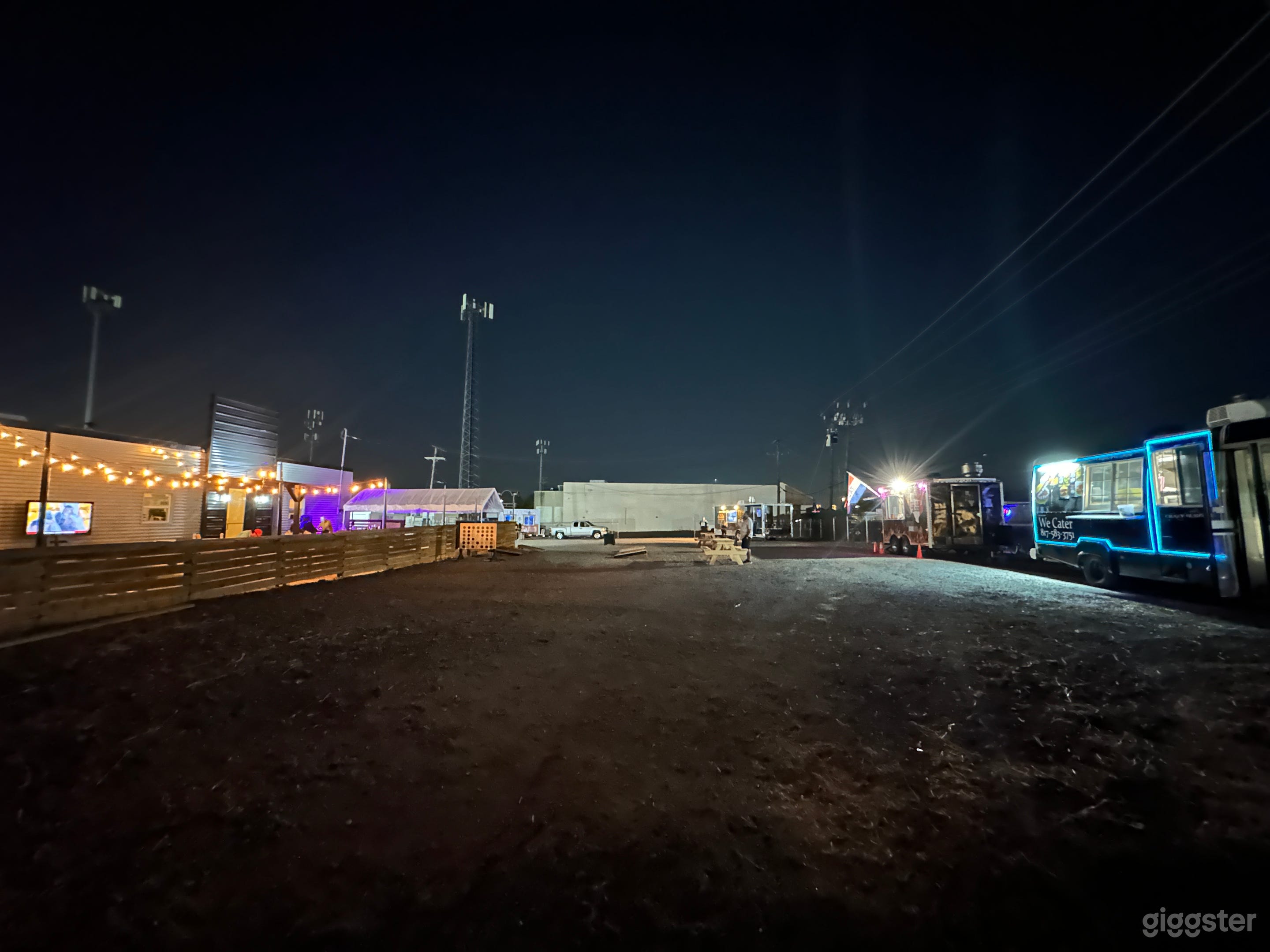 At the entrance of the lot during a food truck event
