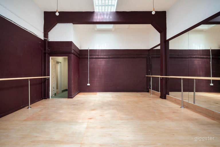 Versatile Dance Studio with Mirrored Wall and Barre Rail 