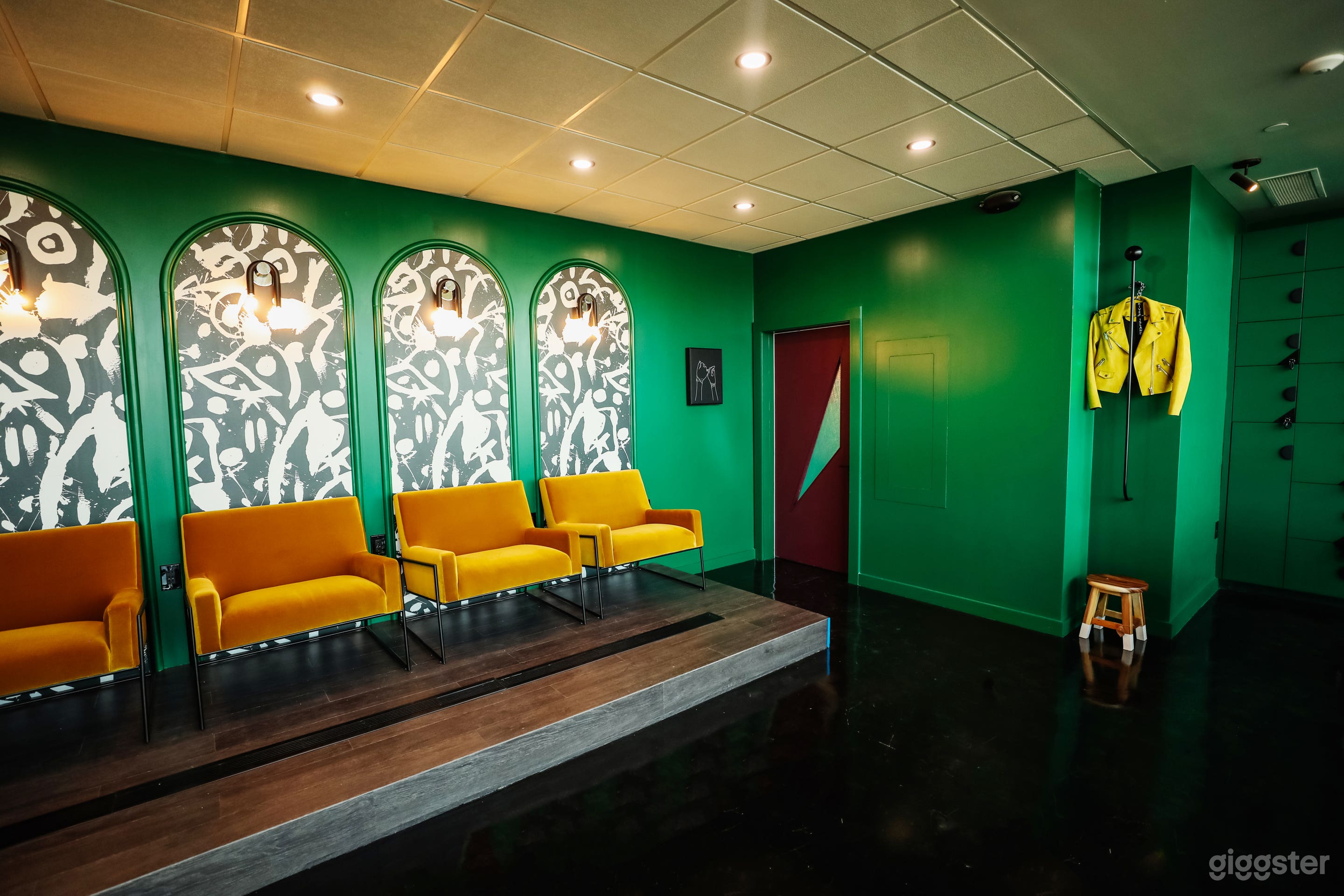 Built in platform / riser area, chairs can be moved. Clothing rack available in inlet. Looks like art on its own without clothing hanging from it. 