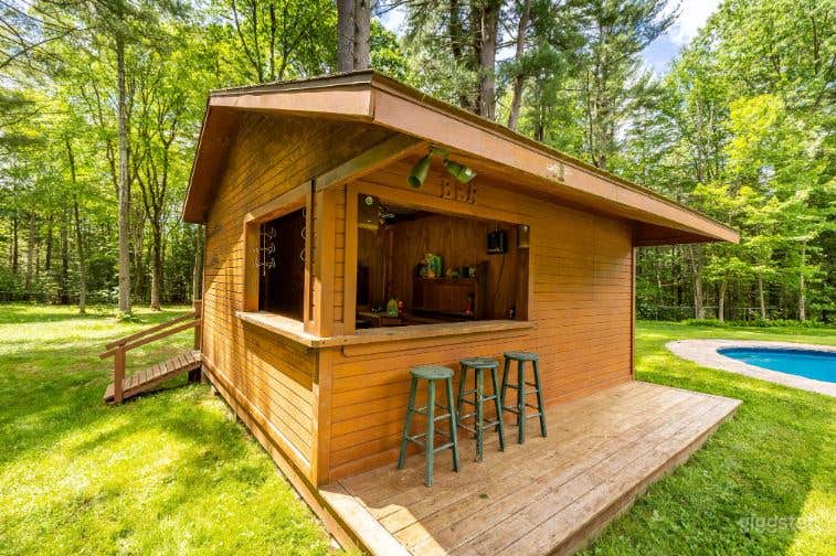Relaxing Swimming Pool with Manicured Yard Photo 3