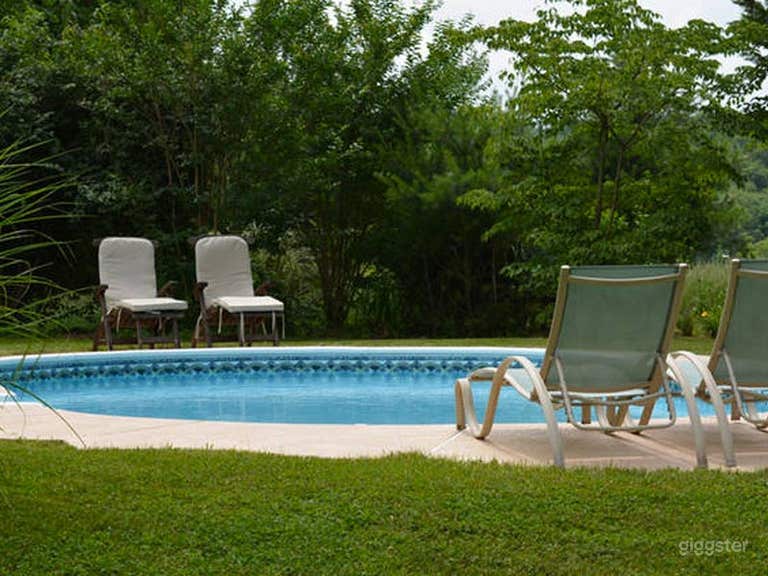  11-Gallon Oval Pool Surrounded by Lush Grenery 