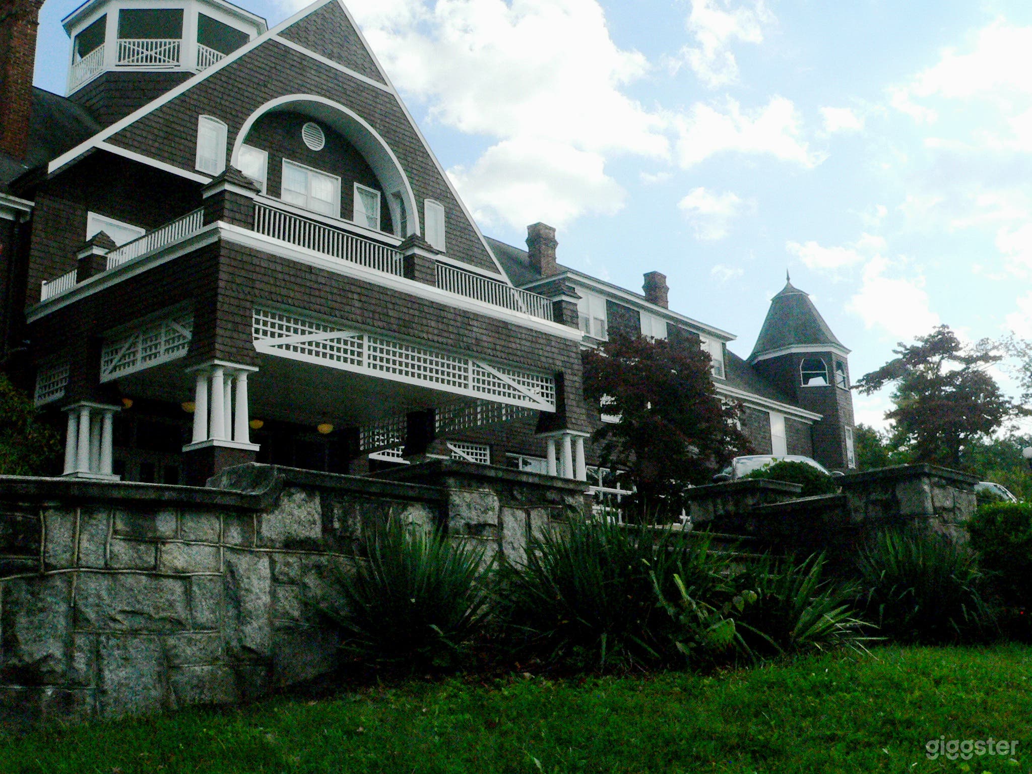 Close up of front porch portico and rock wall