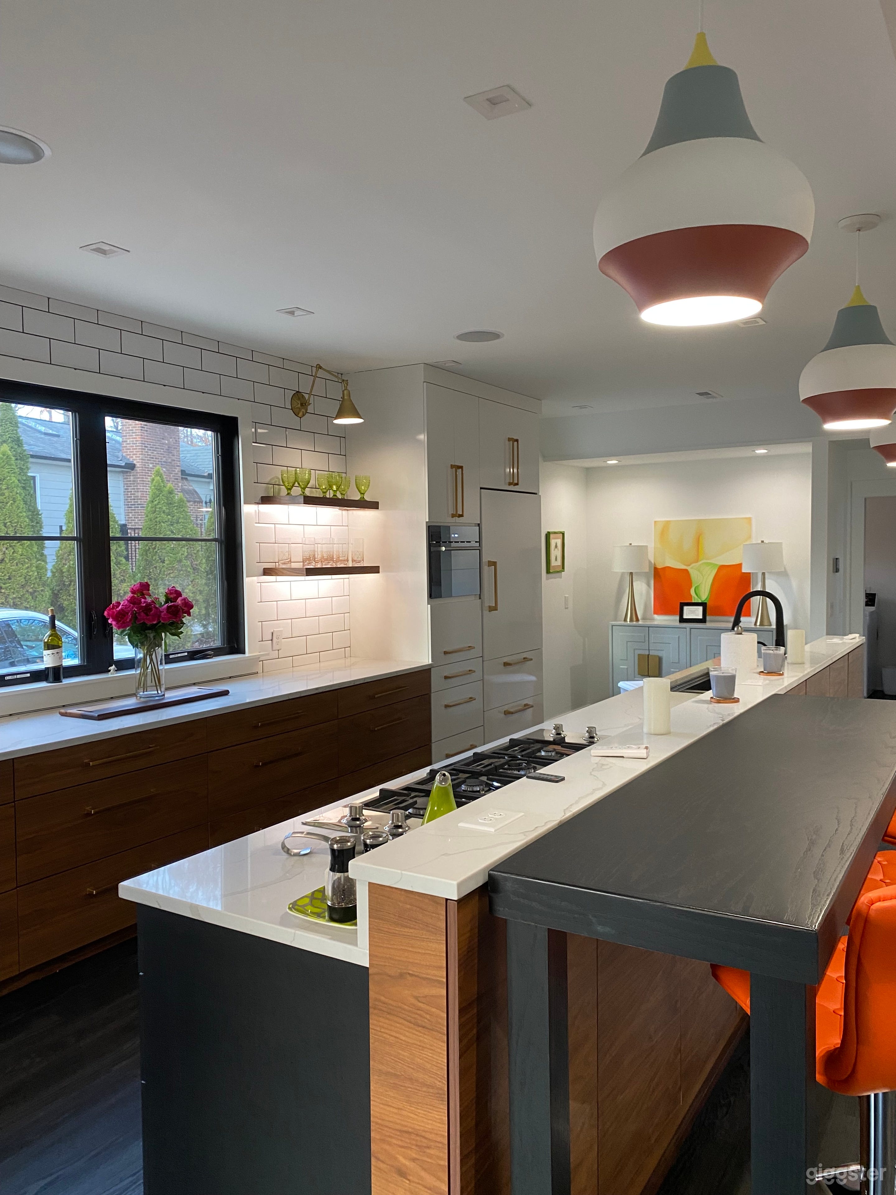 Versitile island with two floating 7' tables on casters that can be relocated throughout the space