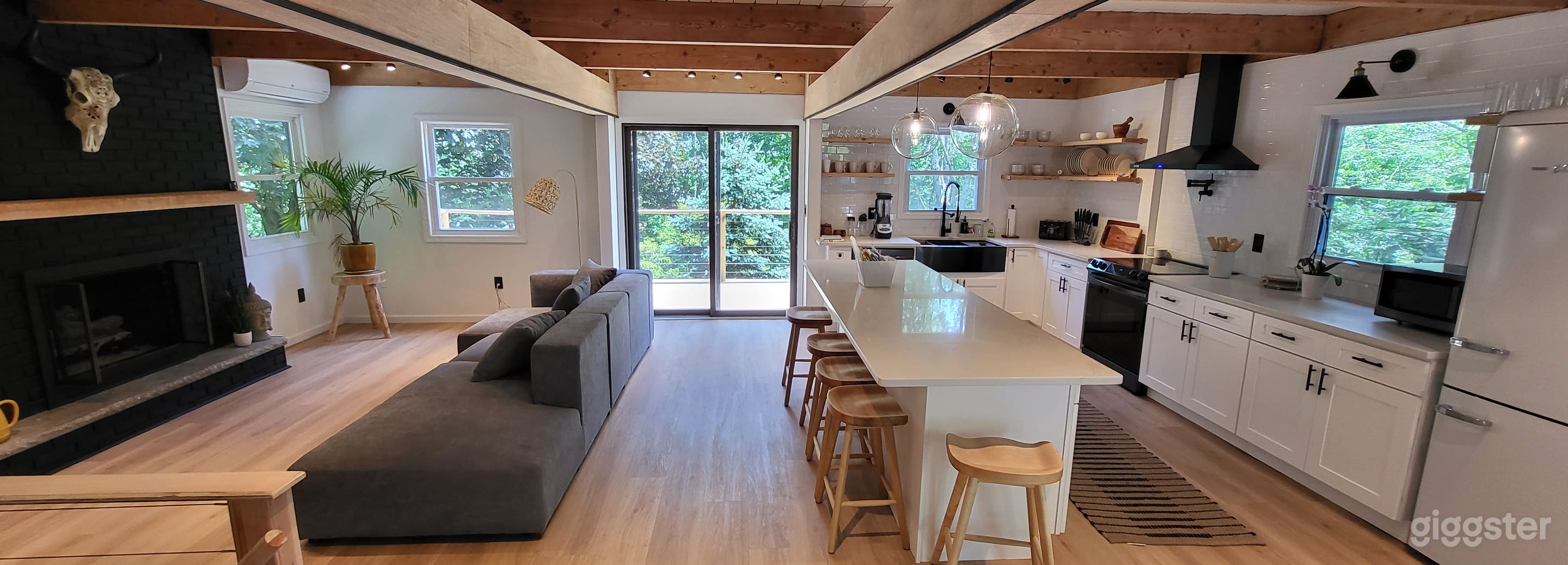 Bohemian Black Cabin with Floor to Ceiling Windows Photo 1