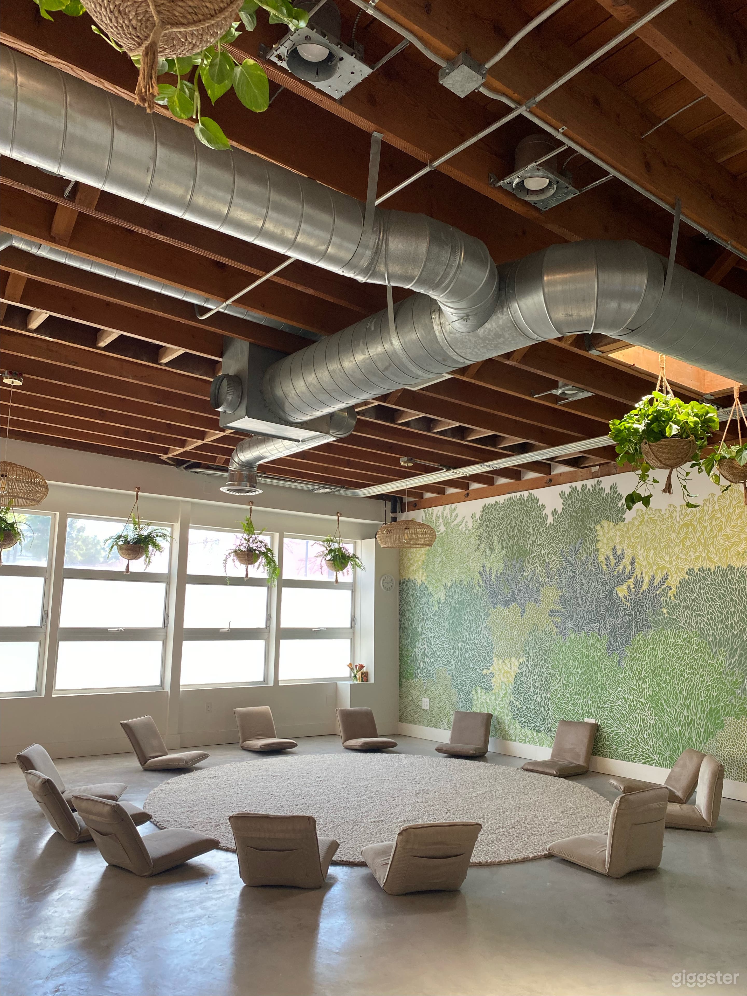 Our main room with a beautiful mural and high ceilings