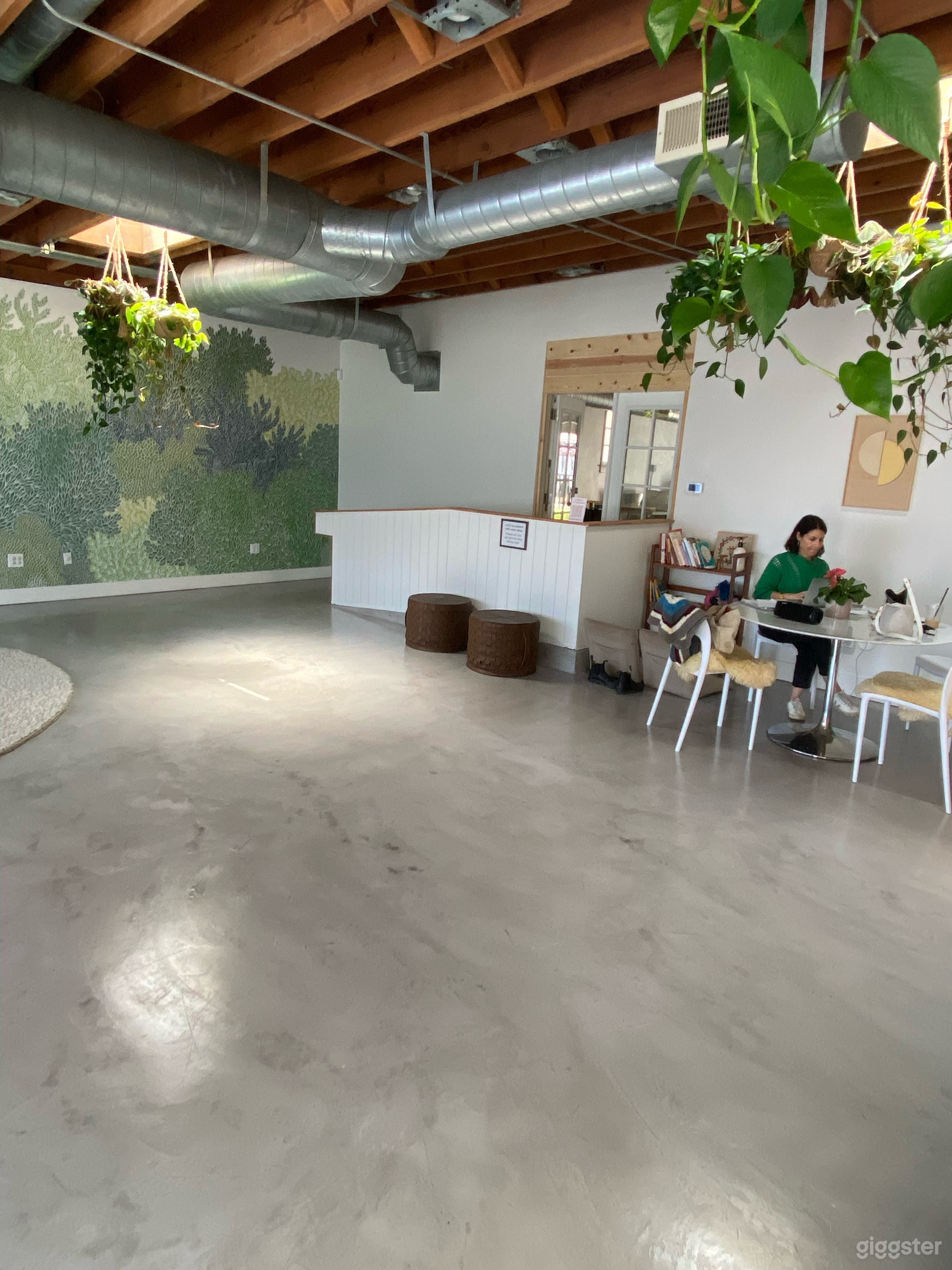 The main room looking towards the back into the other 2 rooms. There is a ramp and french doors, making access very easy.