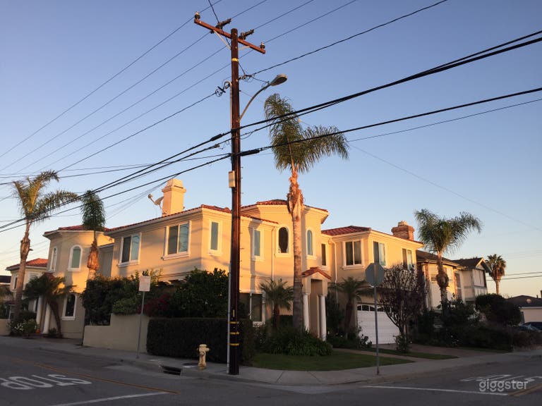  Building at sunset. Left side is the property.  