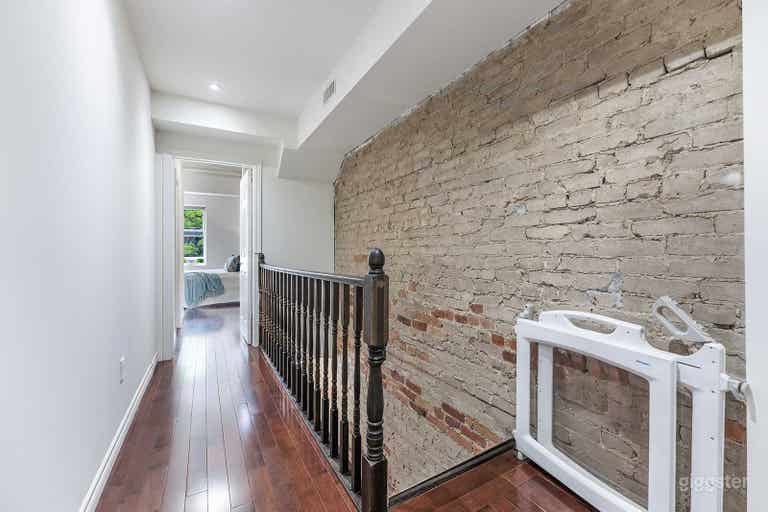  The upstairs has 3 bedrooms that can be used for any purpose. A primary bedroom with very high ceilings (very bright!!), fireplace, flat screen tv, and modern ensuite bathroom. 