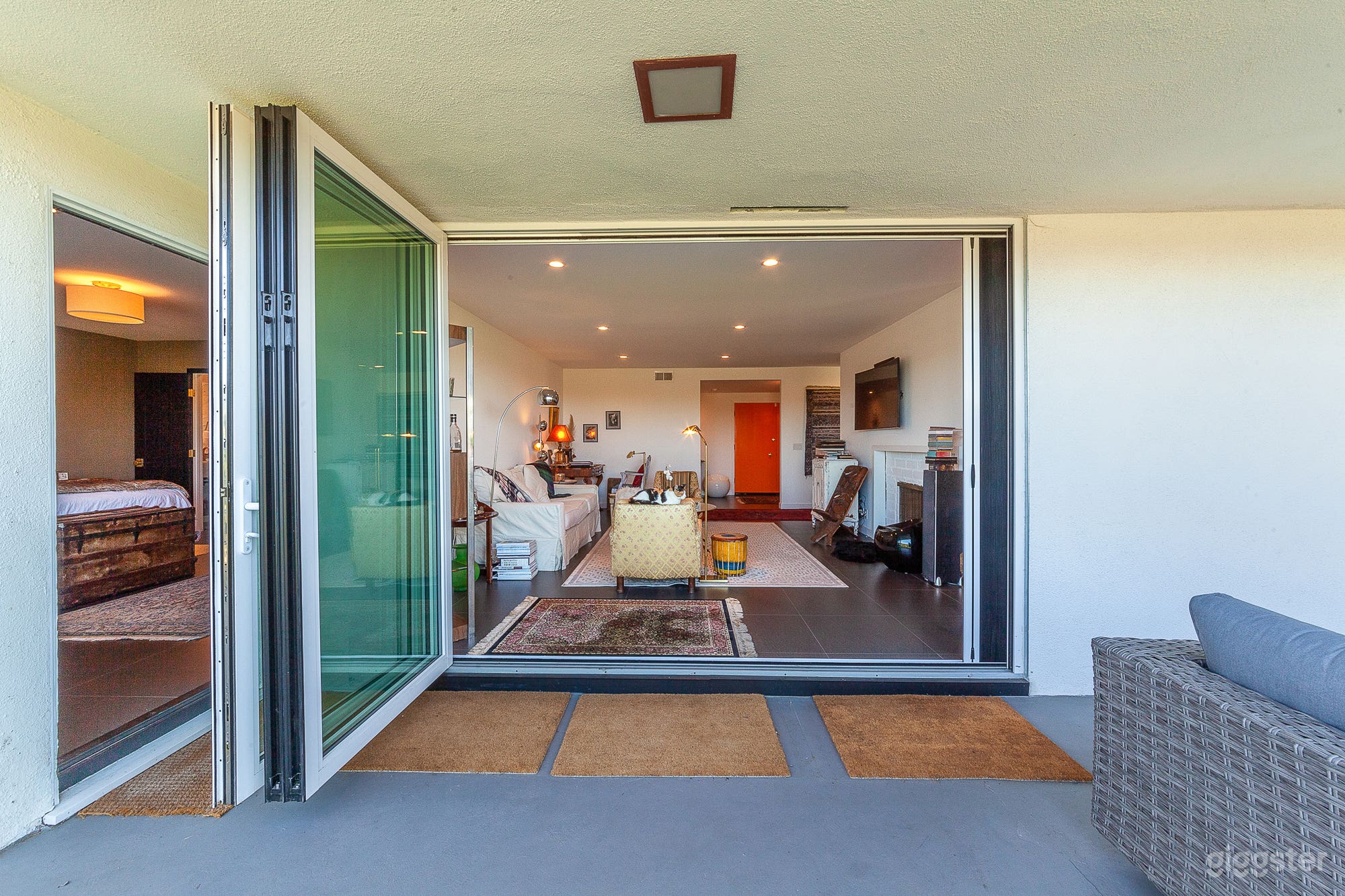 Living room opens to spacious patio area