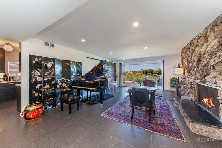  Living room features Kawai grand piano and fireplace. 